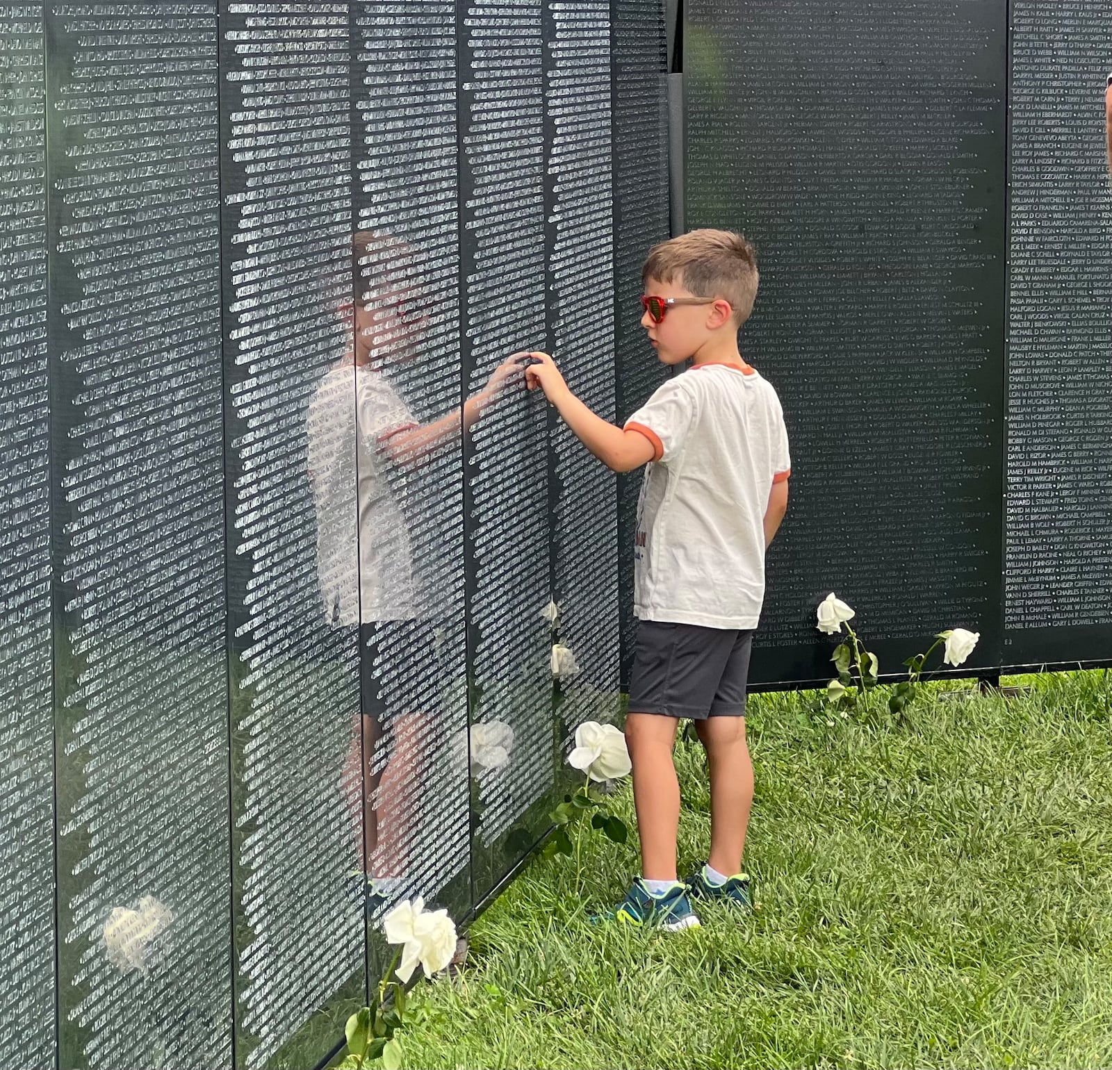 Visitors young and old showed their respect on Saturday to those who lost their lives during the Vietnam War. The traveling Vietnam Wall memorial, also known as "The Wall That Heals," was temporarily erected at Yankee Park in Centerville. AIMEE HANCOCK/STAFF