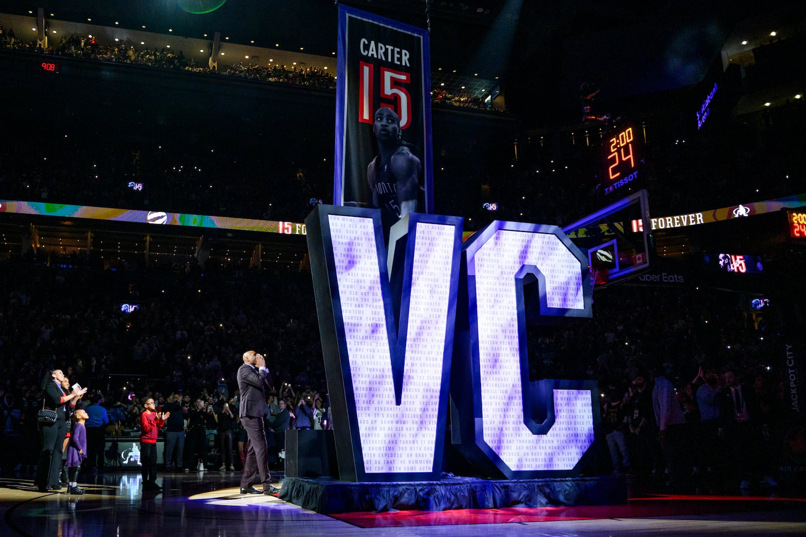 Former Toronto Raptors player Vince Carter reacts during his number retirement ceremony at halftime of an NBA basketball game between the Toronto Raptors and the Sacramento Kings in Toronto on Saturday, Nov. 2, 2024. (Christopher Katsarov/The Canadian Press via AP)