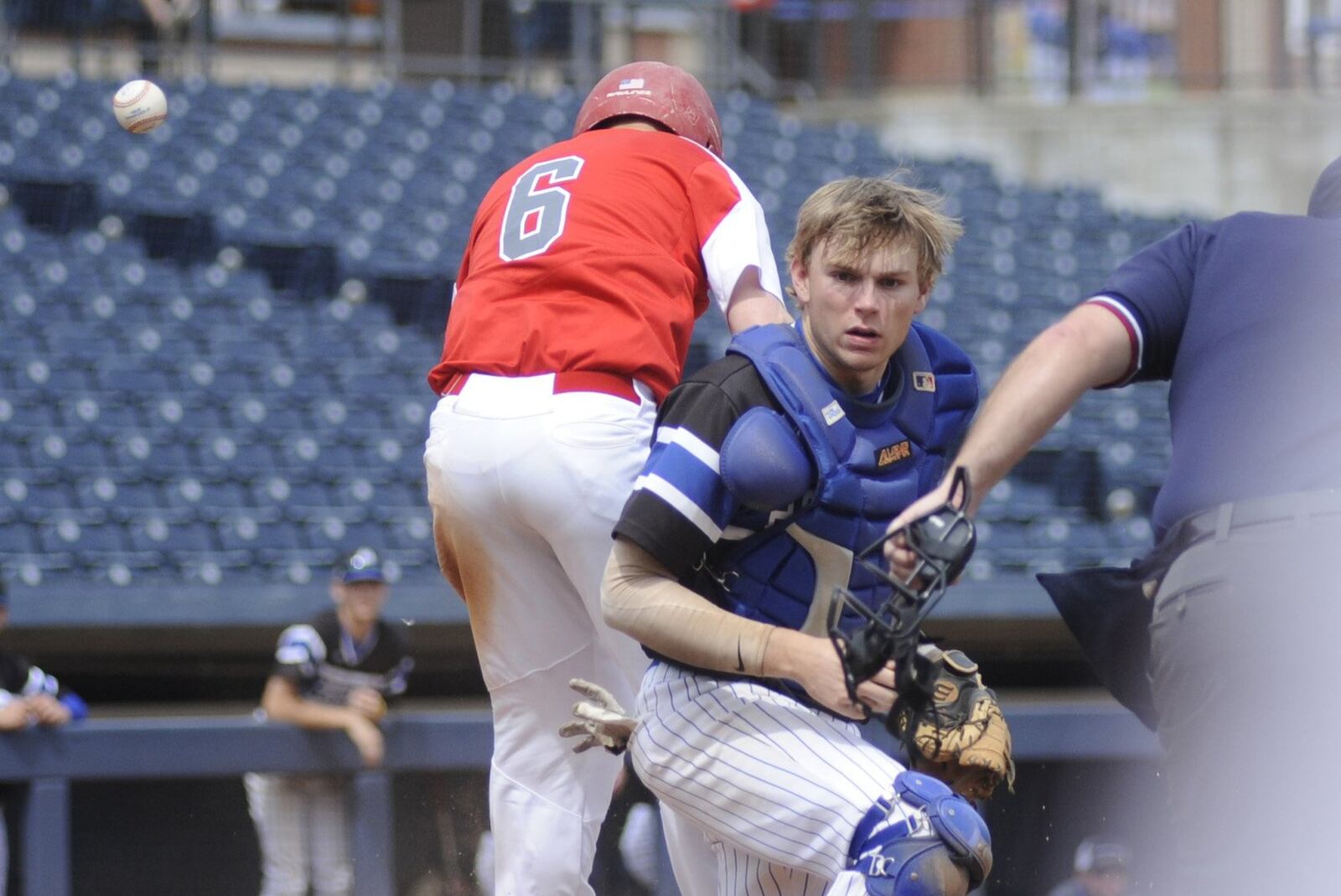 Springboro senior catcher Jake D’Amico couldn’t prevent Andrew Witte of Mentor from scoring in the fifth inning. Mentor defeated Springboro 4-0 in a D-I baseball state semifinal at Akron’s Canal Park on Friday, June 7, 2019. MARC PENDLETON / STAFF