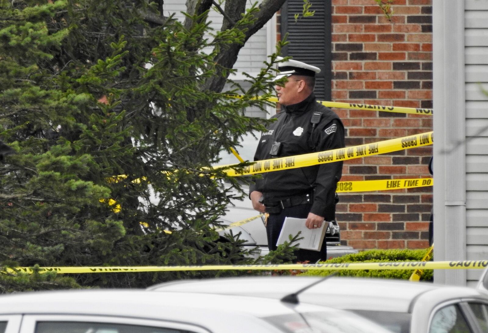 Several investigators remain on the scene Monday morning, hours after four people were found dead inside a unit at the Lakefront at West Chester apartment complex. The deaths of the four are being investigated as homicides, according to police. Nick Graham/Staff