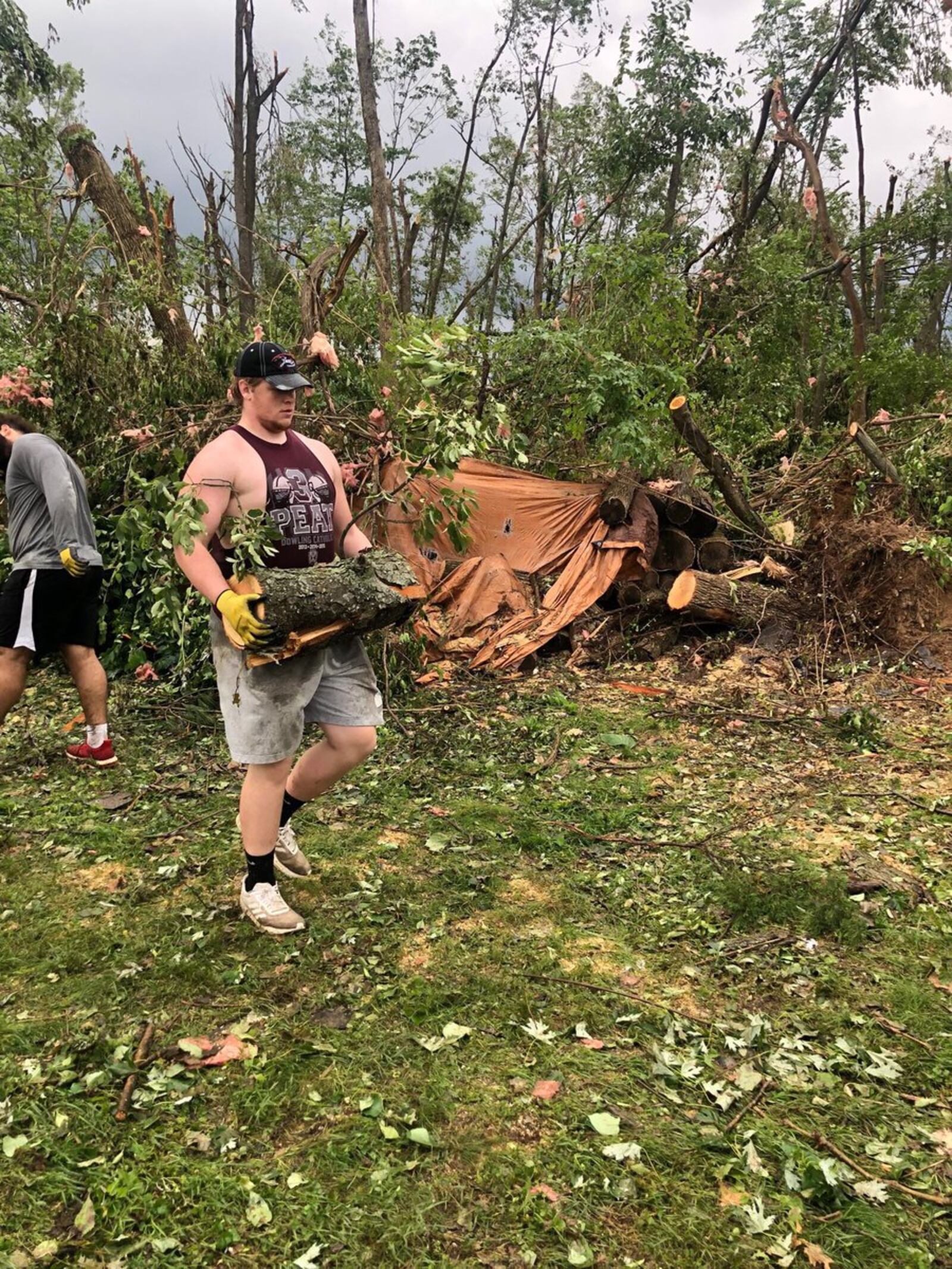 Miami football helps with cleanup of Beavercreek on Friday