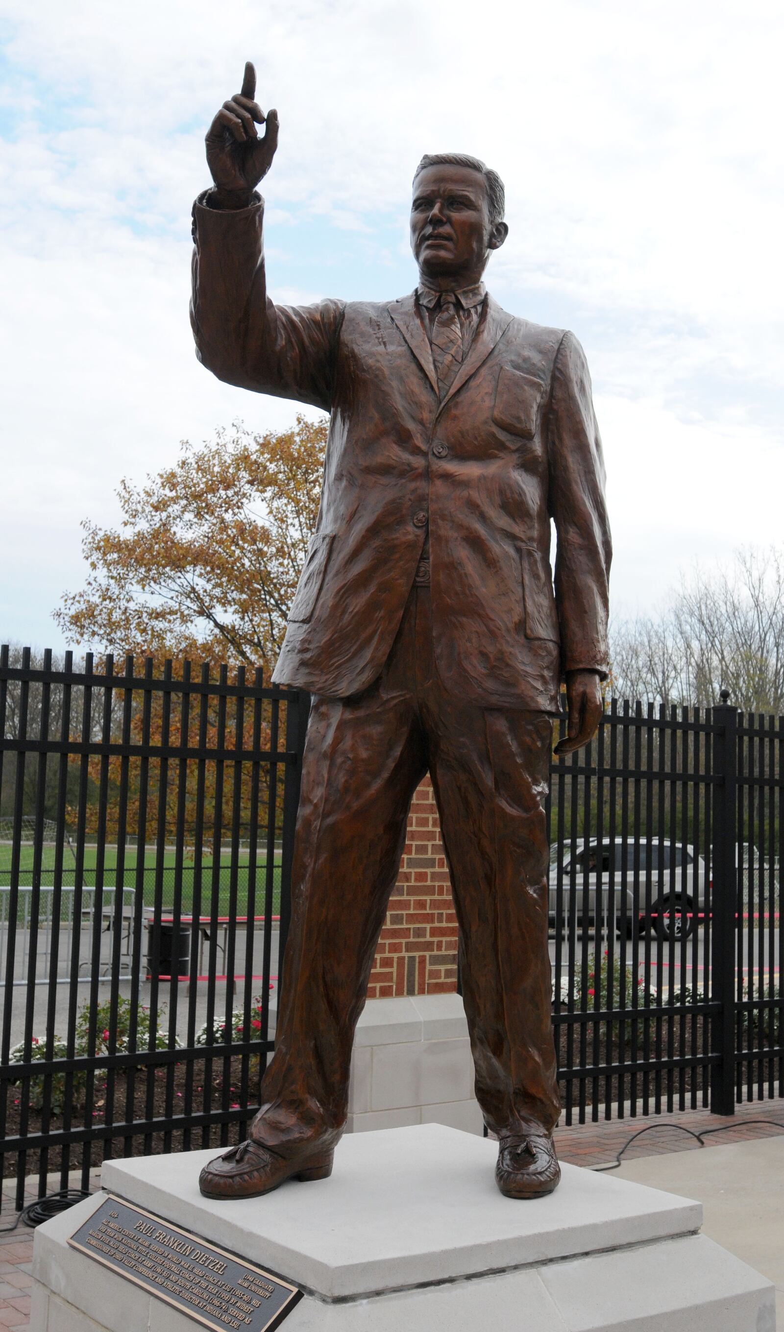 A statue is unveiled of Paul Dietzel in the Cradle of Coaches Plaza at Miami University on Saturday, Oct. 23. Staff photo by Samantha Grier.