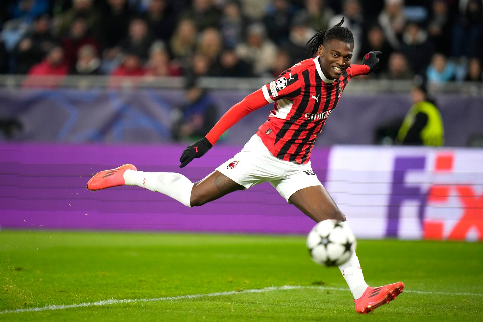 AC Milan's Rafael Leao scores the second goal against Slovan Bratislava during the Champions League opening phase soccer match between Slovan Bratislava and AC Milan in Bratislava, Slovakia, on Tuesday, Nov. 26, 2024. (AP Photo/Petr David Josek)