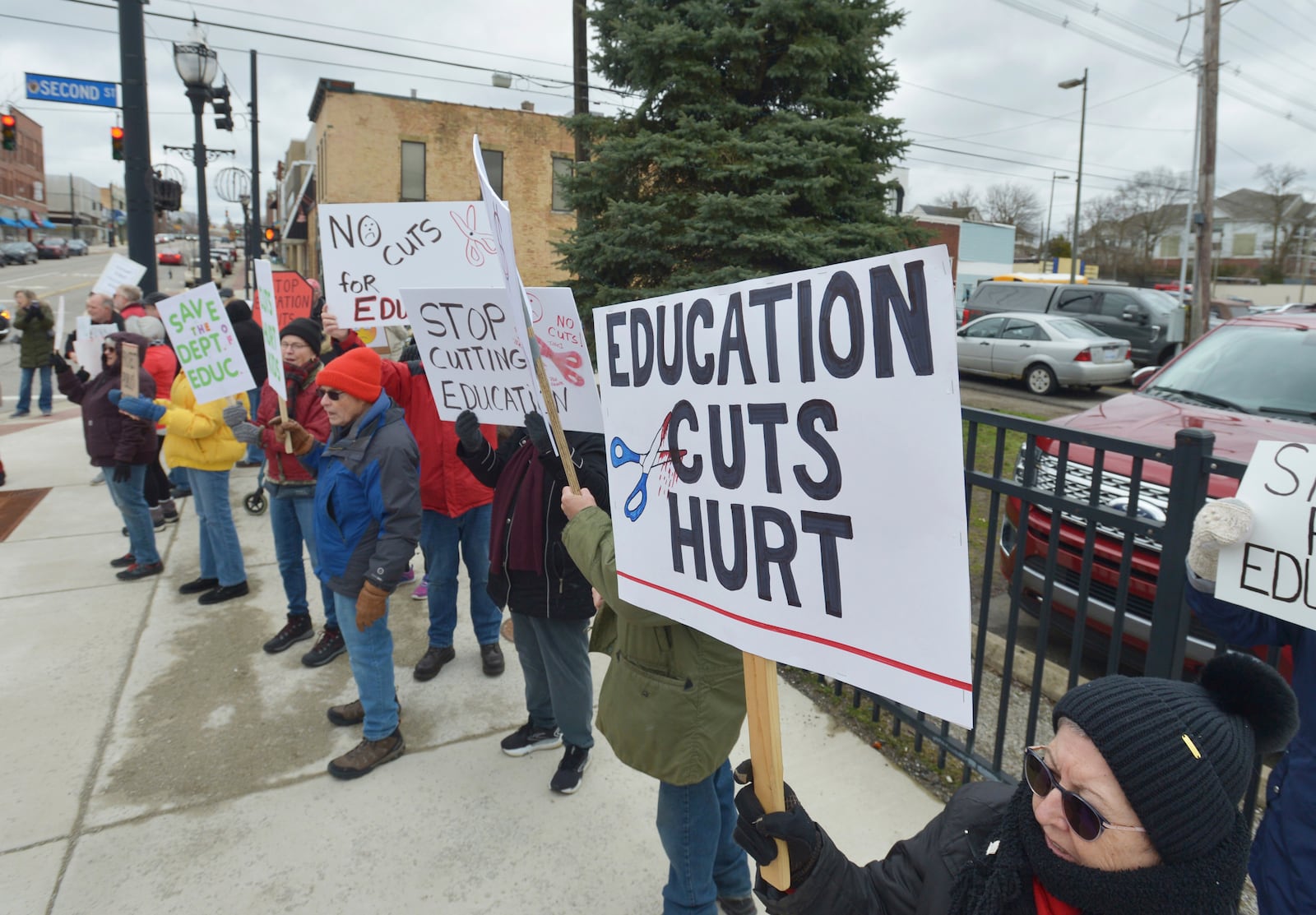 Dozens of people gather in downtown Niles, Mich., Thursday, March 20, 2025, to protest recent government cuts in the Department of Education. (Don Campbell/The Herald-Palladium via AP)