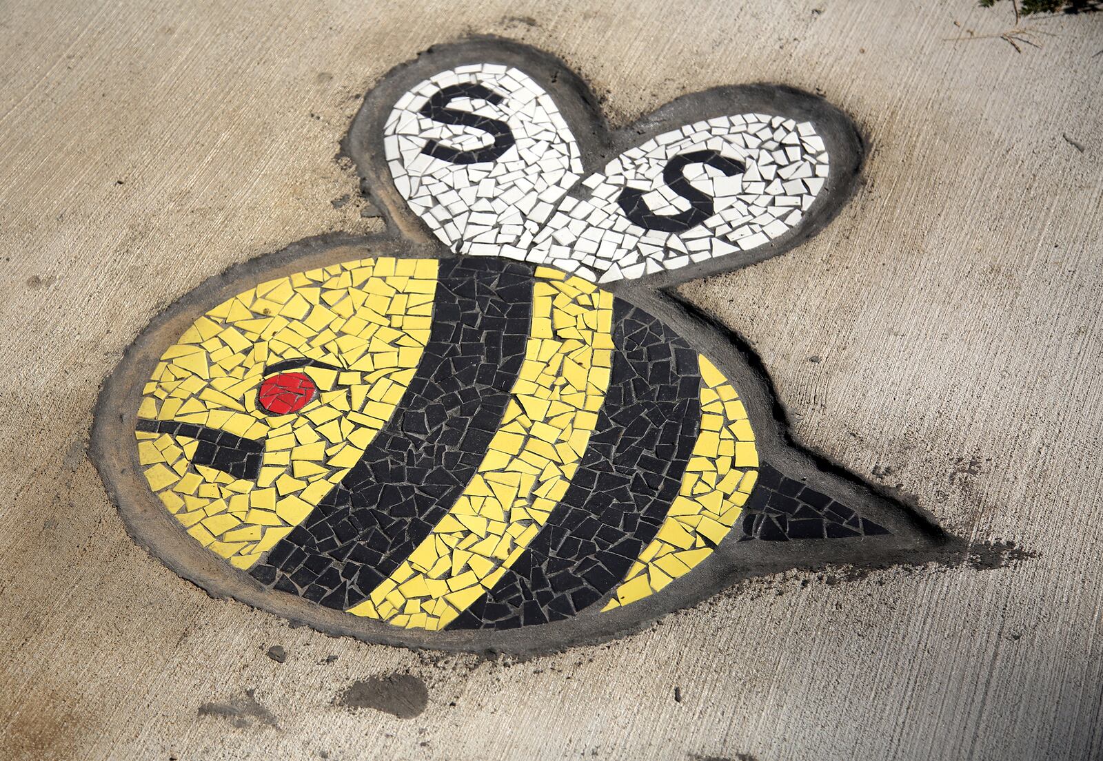 Ten mosaic bumble bees, each with their own personality, have been created in the Haverstick neighborhood in Ketteirng. The bees are part of a larger public art project, "Bee Ambitious," a series of games for the community. LISA POWELL / STAFF