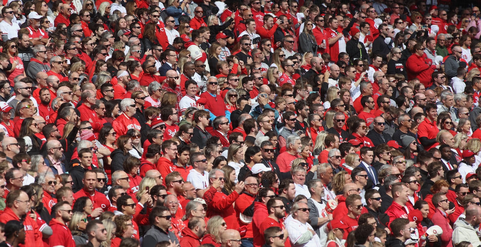 Fans stand for the national anthem on Opening Day before a Reds game against the Nationals on Thursday, March 28, 2024, at Great American Ball Park in Cincinnati. David Jablonski/Staff