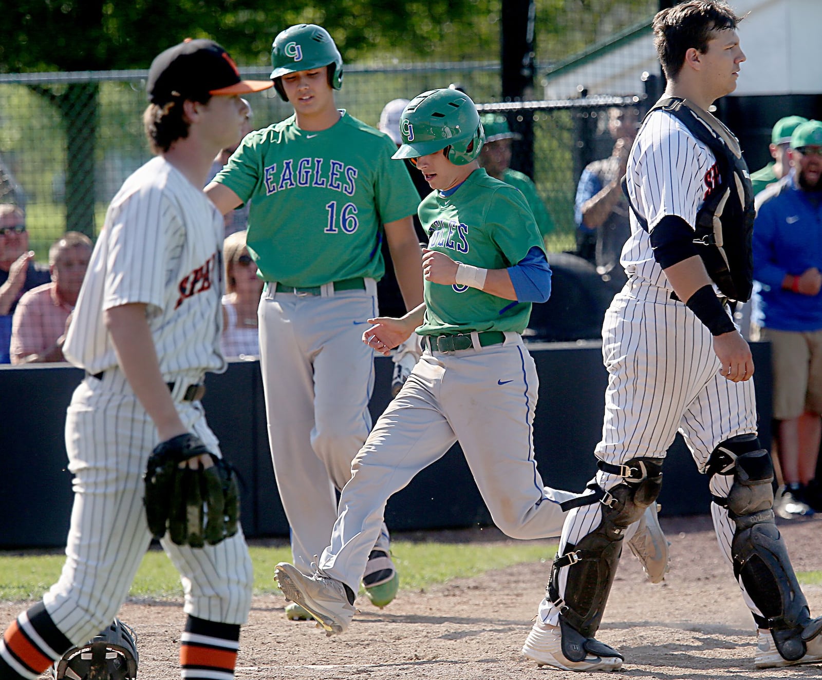 Chaminade Julienne’s Cameron Benoit scores a run against Waynesville during their Division II regional semifinal at Mason on Friday. CONTRIBUTED PHOTO BY E.L. HUBBARD