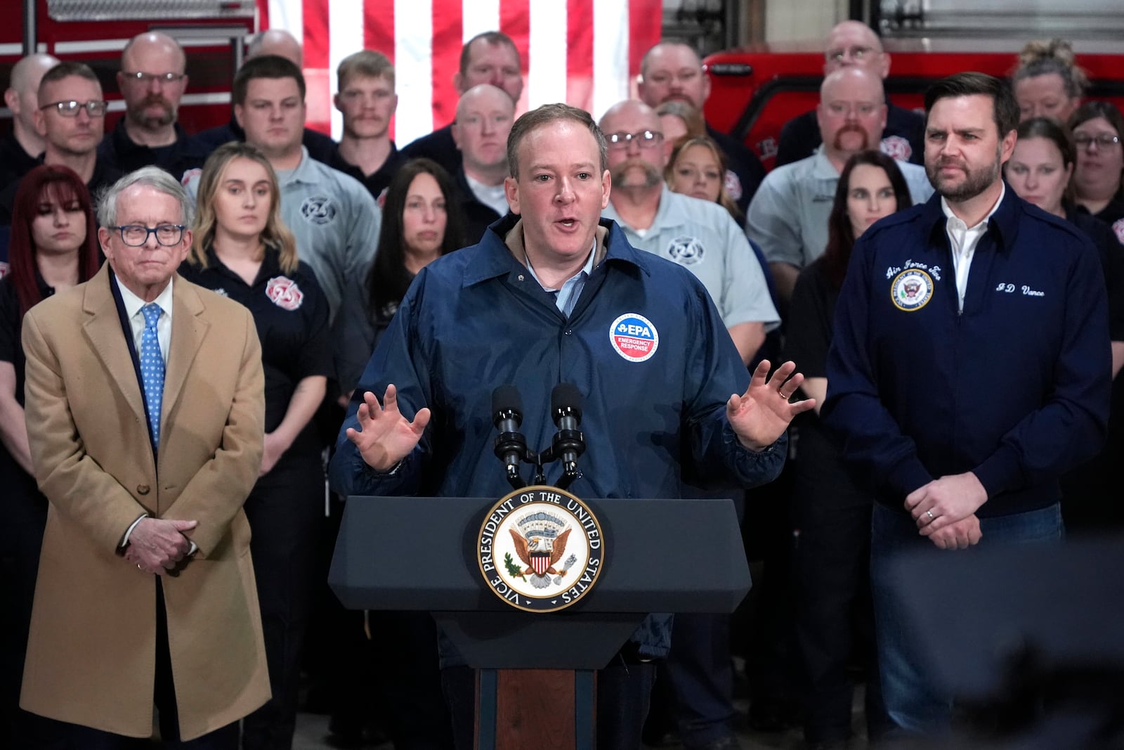 FILE - Vice President JD Vance, right, and Ohio Gov. Mike DeWine, left, listen as Environmental Protection Agency administrator Lee Zeldin, center, speaks in East Palestine Fire Station on Feb 3, 2025, in East Palestine, Ohio, Feb. 3, 2025. (AP Photo/Gene J. Puskar, File)