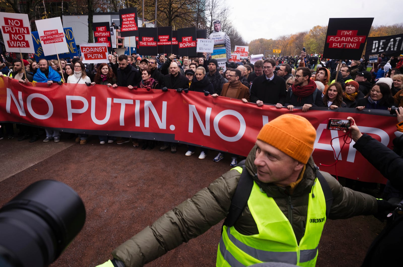 Yulia Navalnaya, center, leads with Russian opposition politician Vladimir Kara-Murza, center left, and Ilya Yashin, center right, a demonstration under the slogan "Stop Putin! Stop the War! Freedom for Political Prisoners!" in Berlin, Germany, Sunday, Nov. 17, 2024. (AP Photo/Markus Schreiber)