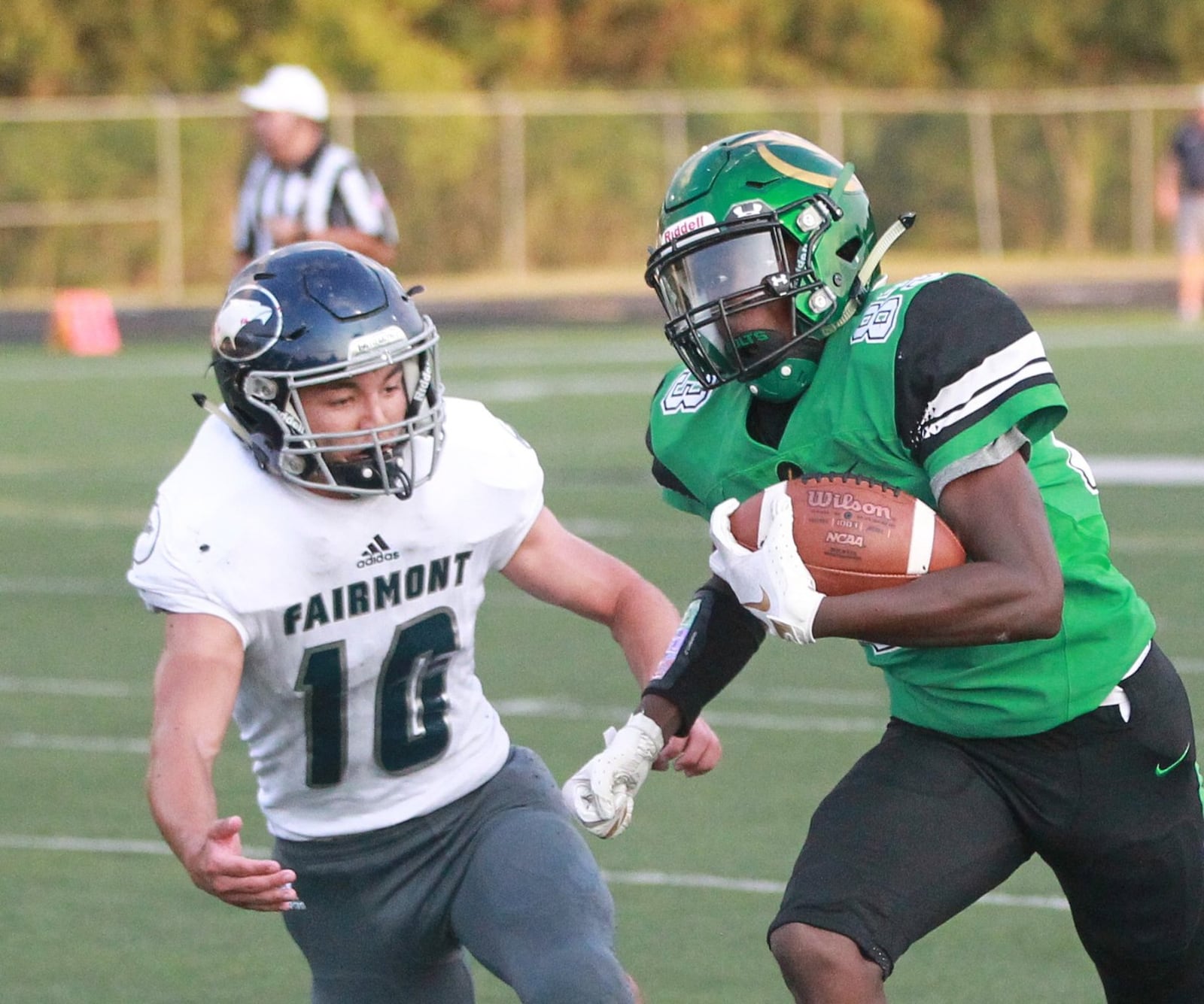 De’Shaun Harewood of Northmont (with ball) out-raced Evan Overholser of Fairmont and scored on a 21-yard catch in the first quarter. Northmont defeated visiting Fairmont 28-14 in a Week 3 high school football game on Friday, Sept. 13, 2019. MARC PENDLETON / STAFF