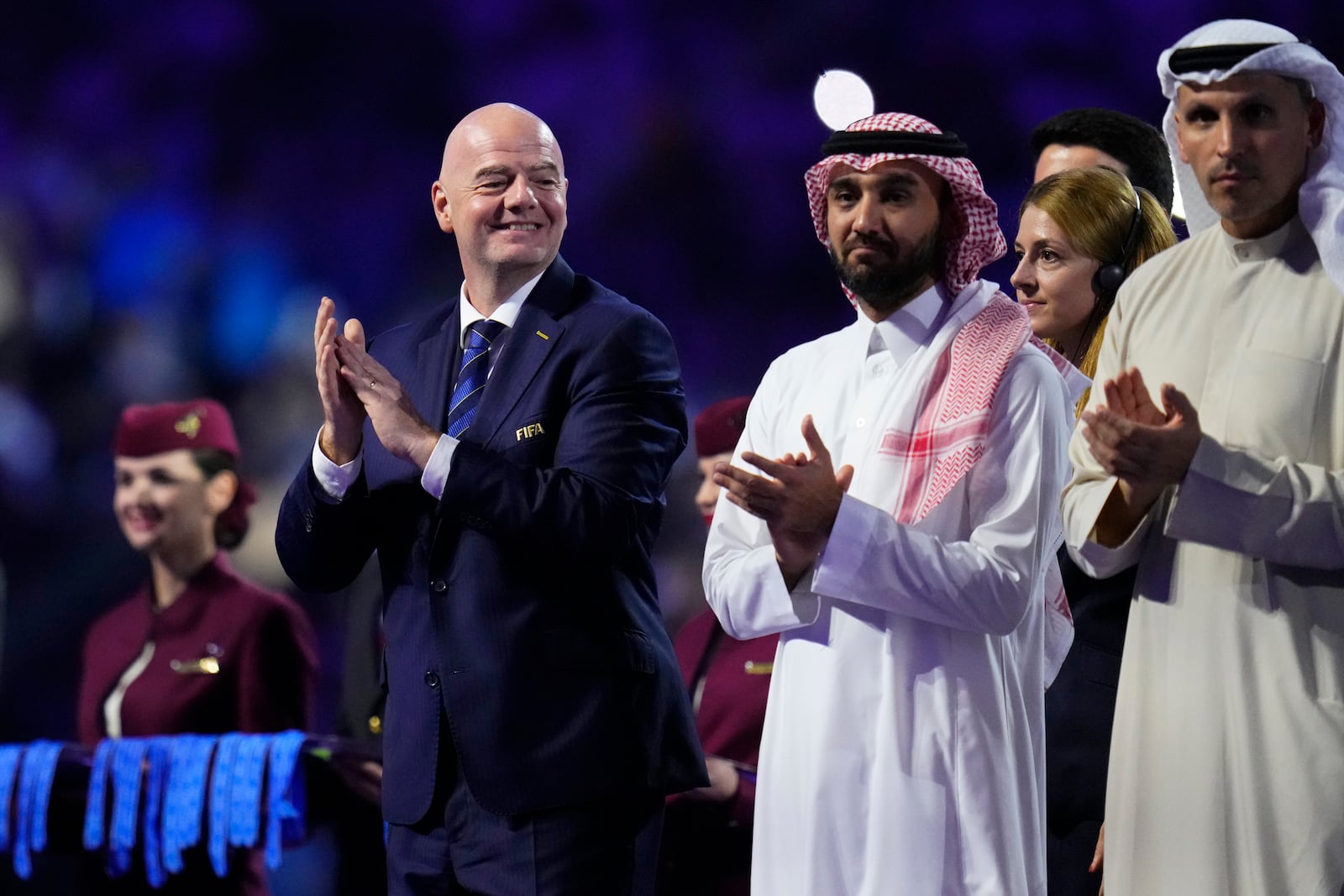 FILE - FIFA President Gianni Infantino, left, applauds during the medals ceremony after the Soccer Club World Cup final match between Manchester City FC and Fluminense FC at King Abdullah Sports City Stadium in Jeddah, Saudi Arabia, Friday, Dec. 22, 2023. (AP Photo/Manu Fernandez, File)