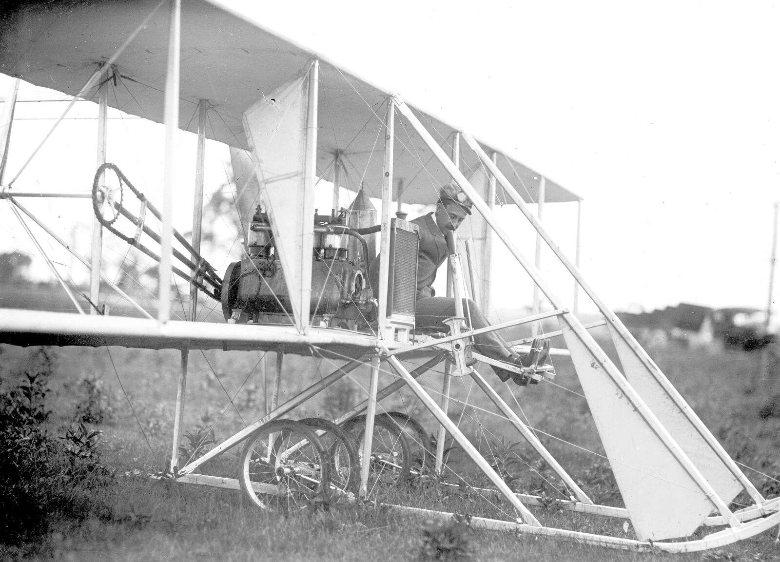 Orville Wright is at the controls of the Wright Model B in 1910 at Huffman Prairie. Photo by William Mayfield from the Marvin Christian Collection