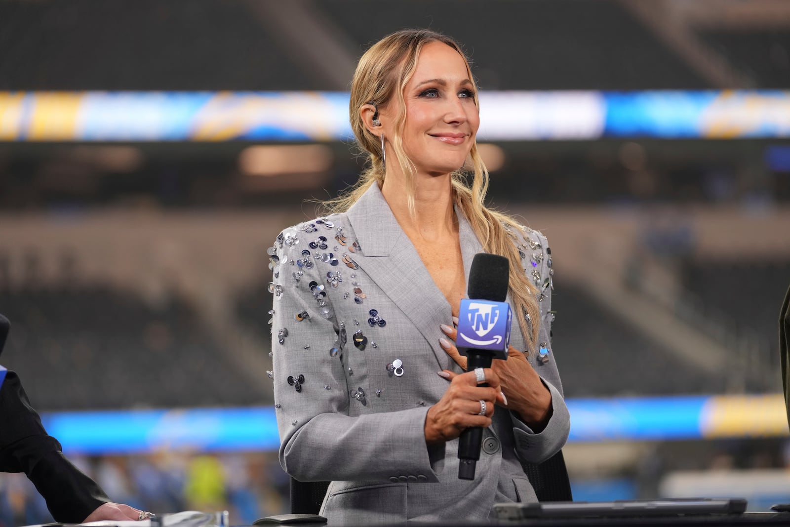 Nikki Glaser participates in a segment after an NFL football game between the Los Angeles Chargers and the Denver Broncos, Thursday, Dec. 19, 2024, in Inglewood, Calif. (AP Photo/Eric Thayer)