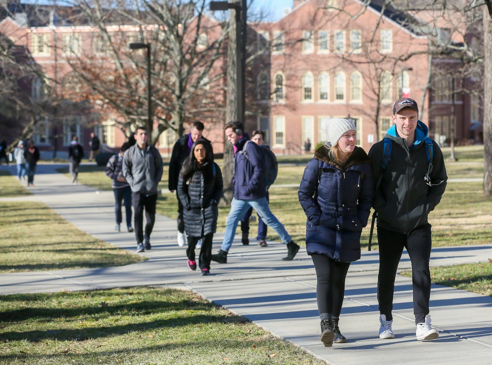 Students walk through the campus of Miami University in Oxford, Wednesday, Feb. 15, 2017. Enrollment at area colleges has dropped from 1 to 4 percent, due to various reasons, including more people going back to work with the improved economy. GREG LYNCH / STAFF