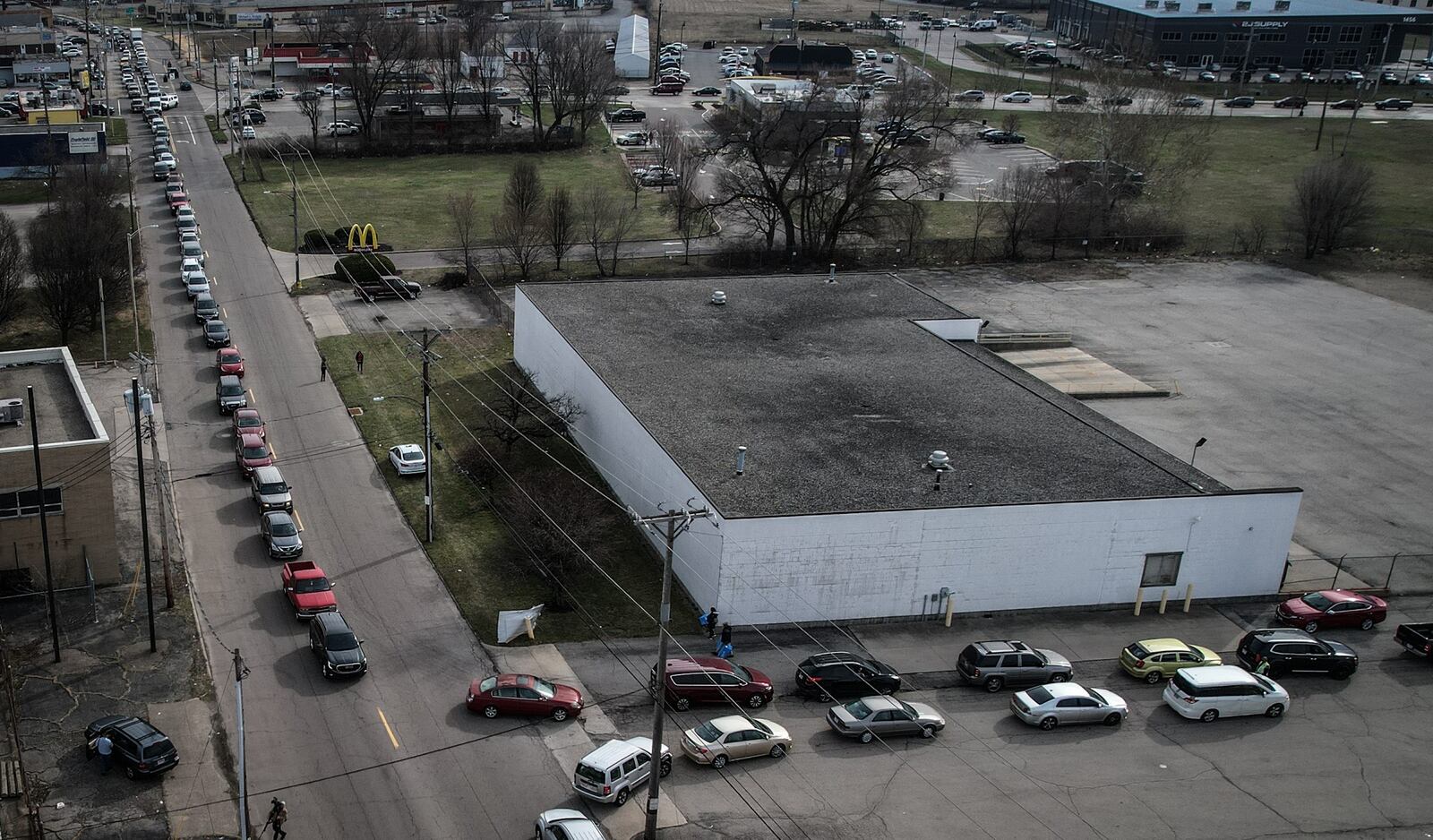 People waiting in line for over an hour for their last chance to buy Mikesell's potato chips that were made at the facility on Leo Street in Dayton, on Thursday morning March 2, 2023. JIM NOELKER/STAFF