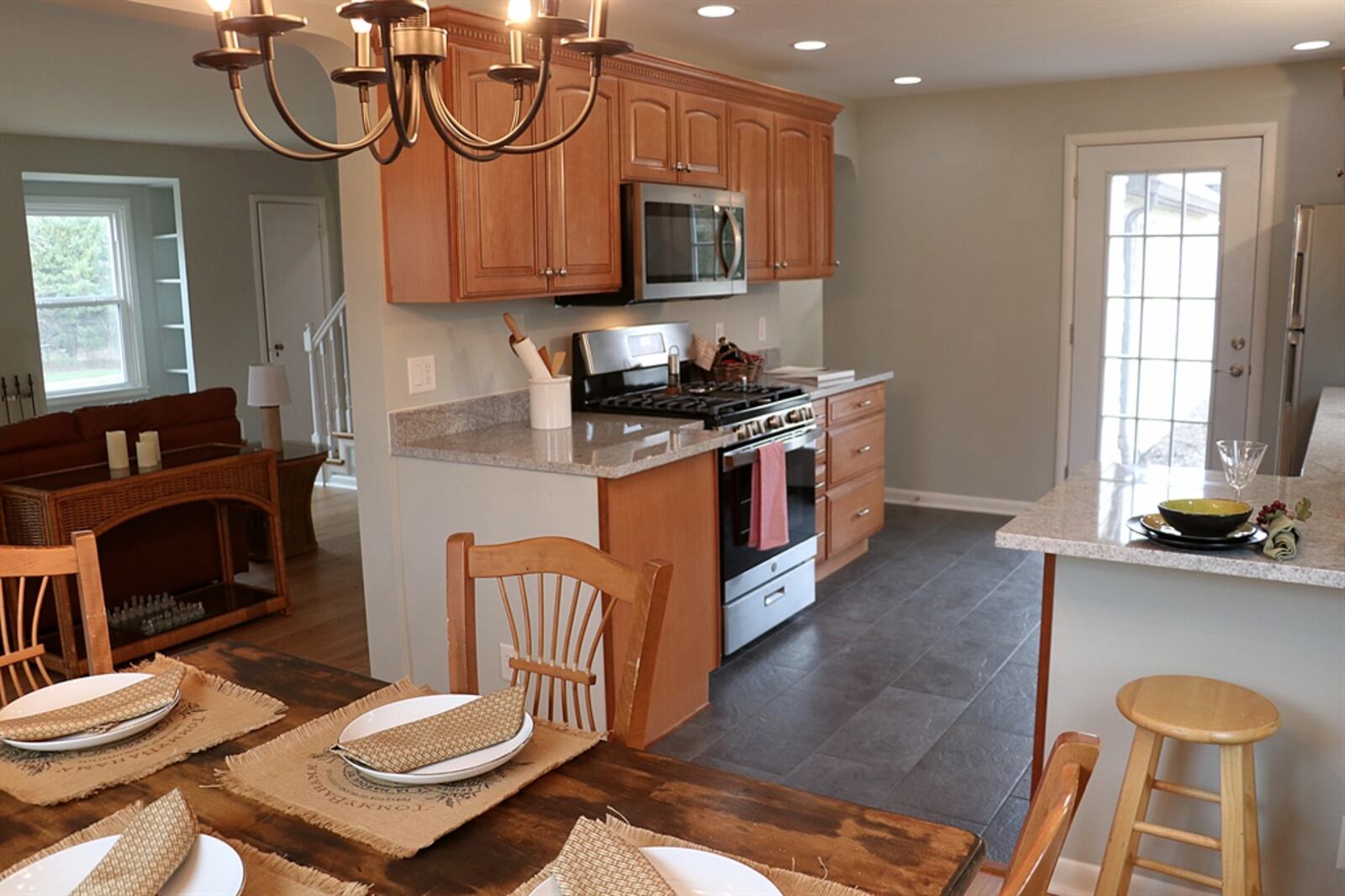 A wall was removed to open the dining room into the kitchen, which was completely redesigned. 