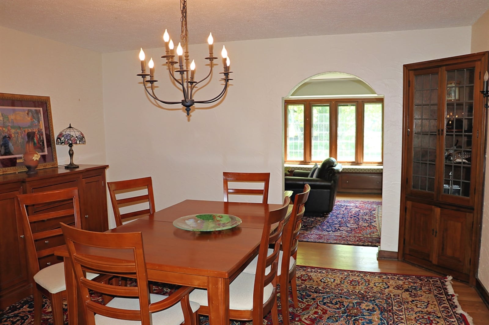 The formal dining room features two corner china hutches. 