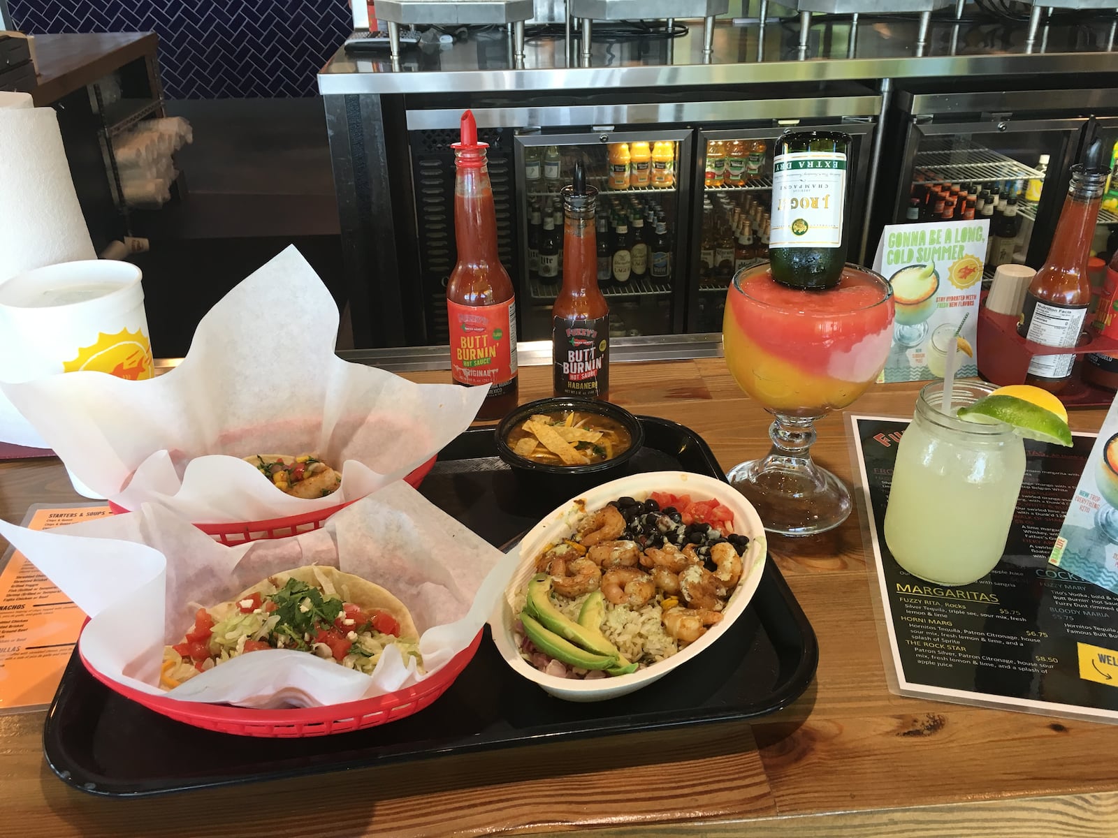 Fuzzy's Taco Shop has a new summer menu that'll inspire you to live your best baja life. With tropical-inspired margaritas, shrimp burrito bowls and mahi mahi tacos topped with mango salsa, you'll be transported to a so-cal state of mind.