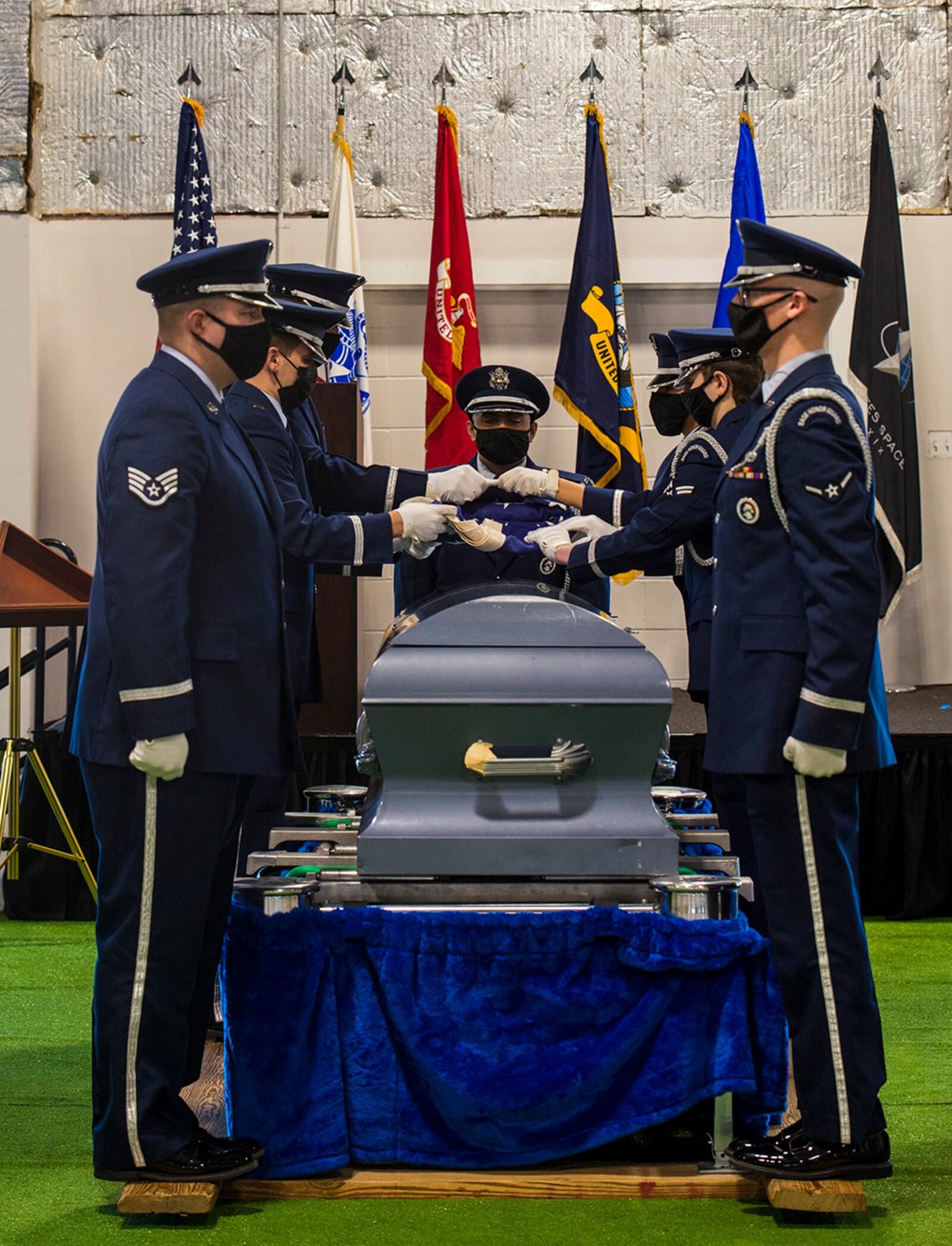 Members of the 88th Air Base Wing Honor Guard perform a flag-folding ceremony during a visit by Gen. Arnold W. Bunch Jr., Air Force Materiel Command commander, and Chief Master Sgt. David Flosi, AFMC command chief, at Wright-Patterson Air Force Base on Jan. 21. U.S. AIR FORCE PHOTO/JAIMA FOGG