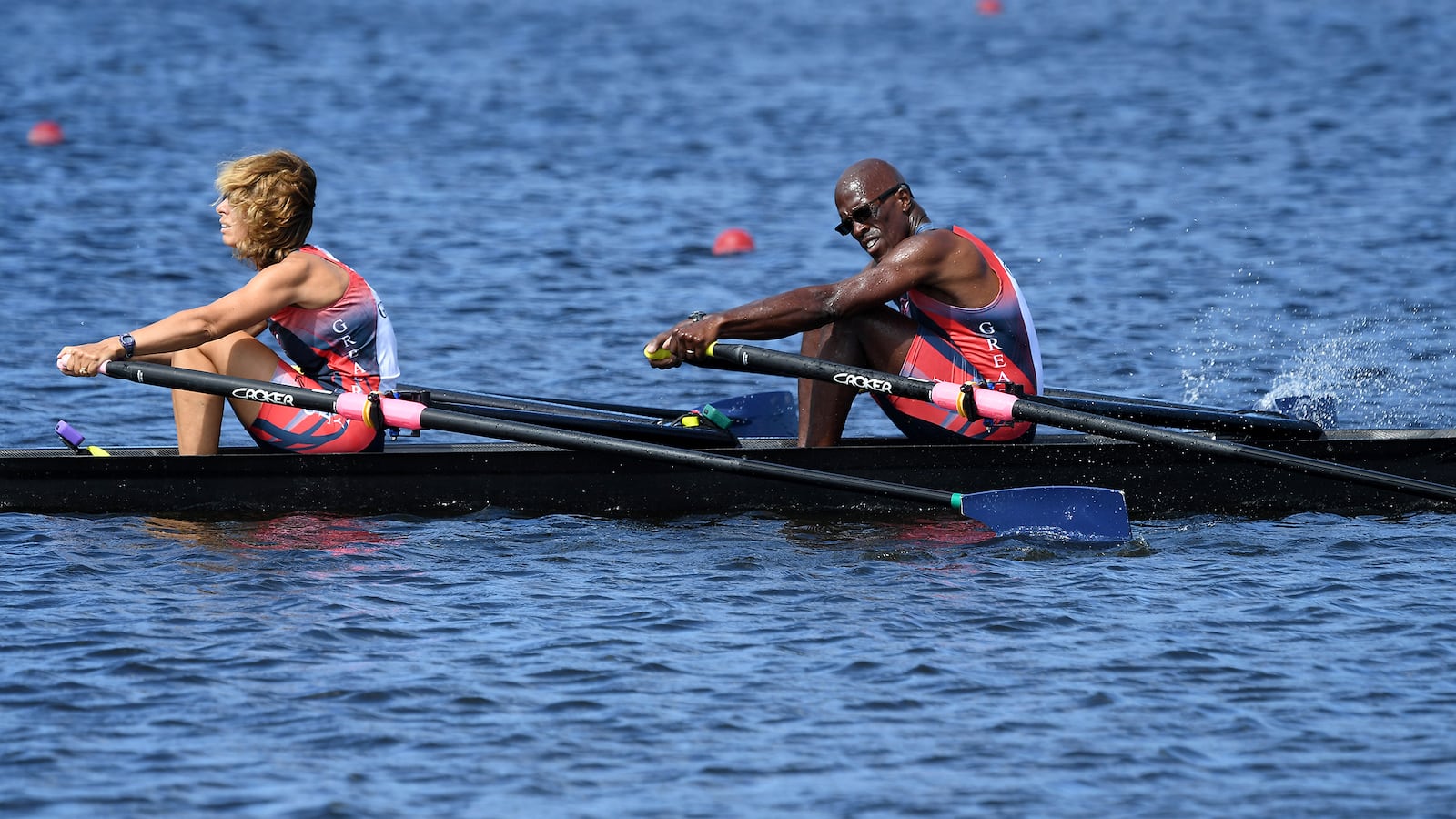 Meg Evans (front) and Brian White (rear) rowing their double boat, named "Mr. Do!" after a video game that played a prominent part in their meeting during college.