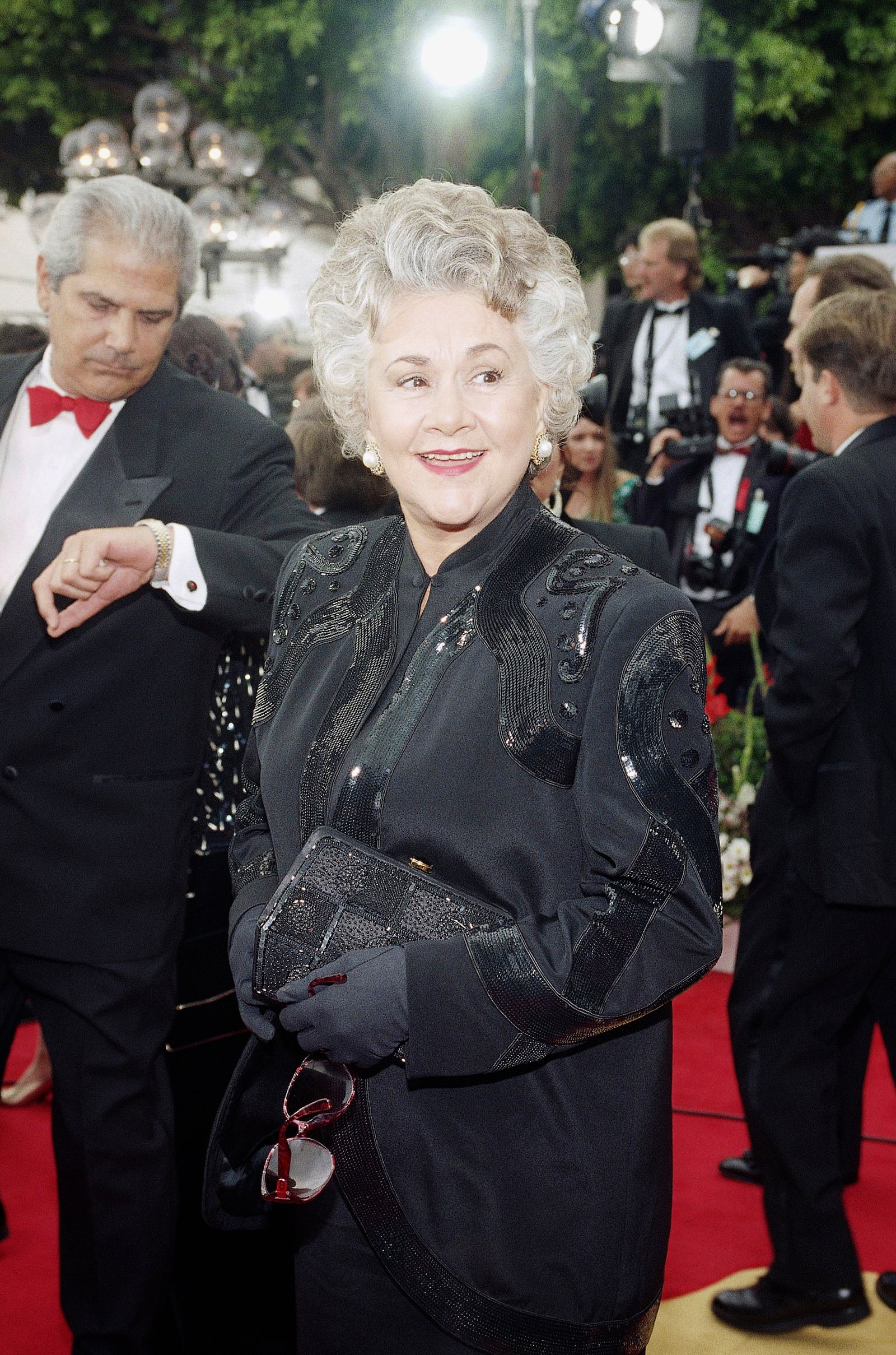 FILE - Joan Plowright, nominated for best supporting actress for her role in 'Enchanted April' arrives at the Music Center in Los Angeles on Monday, March 29, 1993 for the 65th Annual Academy Awards. (AP Photo/Julie Markes, File)