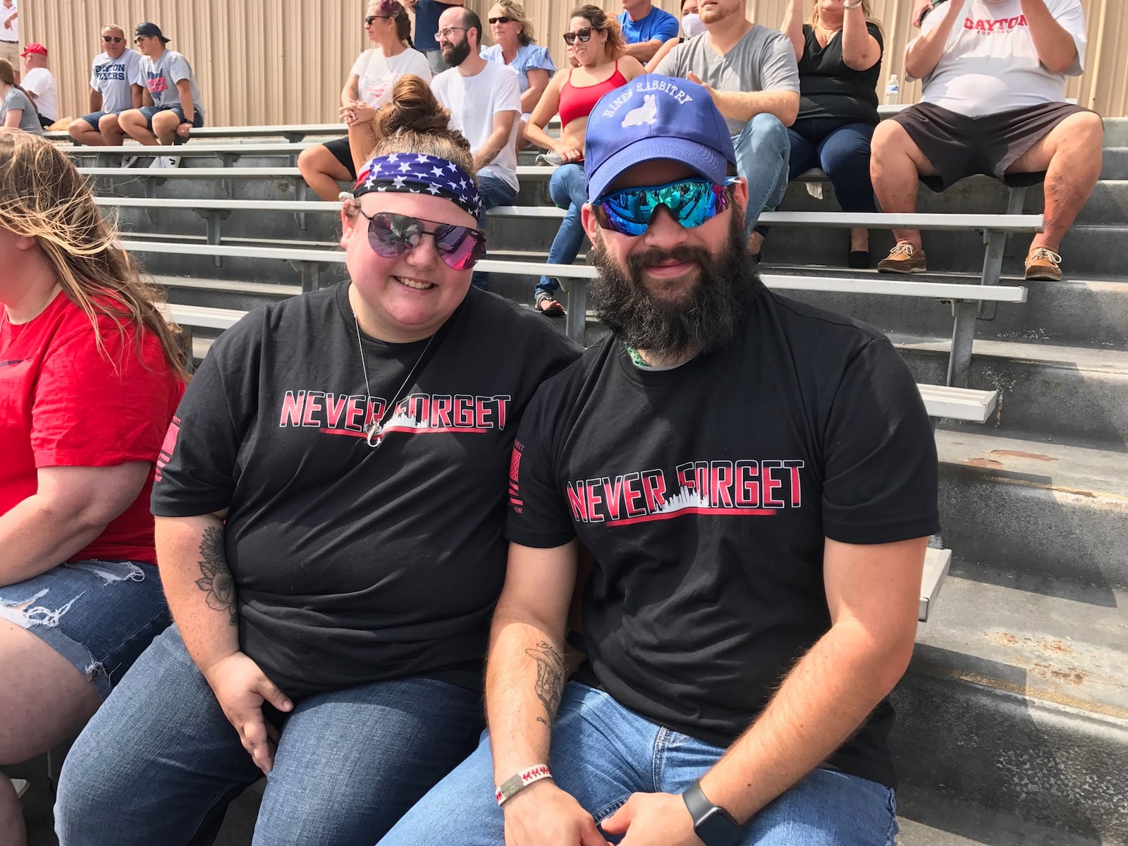 Garth and Cerira Hines of Dayton wear T-shirts commemorating the 20th anniversary of 9/11 at Saturday's UD football game at Welcome Stadium. Tom Archdeacon/STAFF