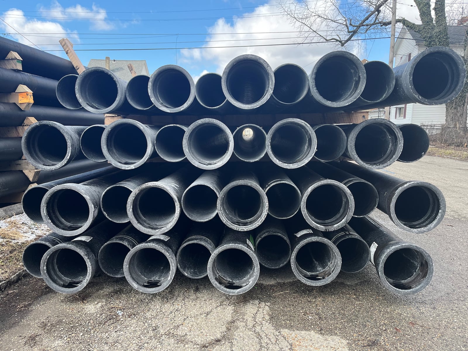 Water pipes stacked up on Bierce Avenue in East Dayton. CORNELIUS FROLIK / STAFF