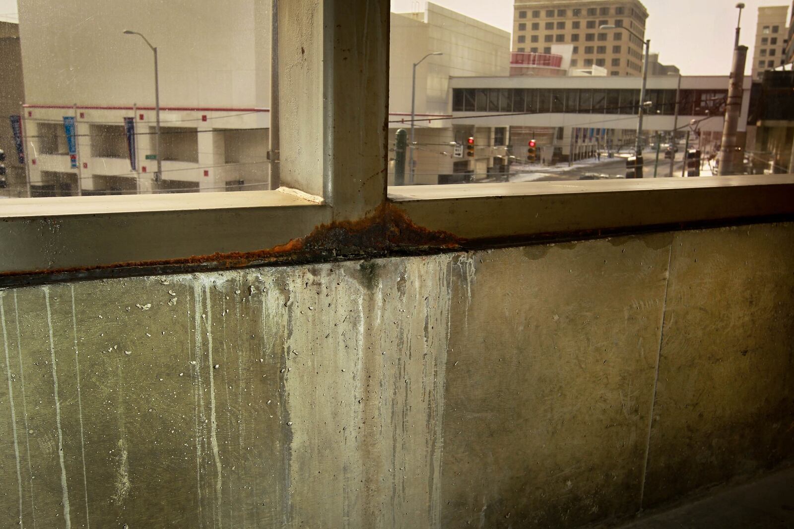 Rust and scale from a leak mar the view in the walkway leading to the Dayton Convention Center from the parking garage. JIM WITMER / STAFF