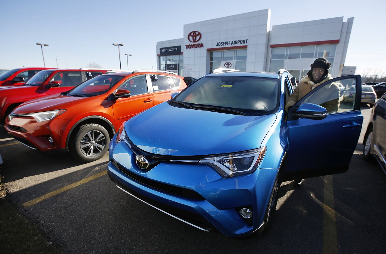 Last year marked the seventh consecutive year of growth for the U.S. auto industry, with new vehicle sales reaching more than 17.55 million - just surpassing 2015’s already record-breaking numbers of 17.5 million. Airport Toyota’s sales and leasing associate Arvin Ridley warmed up a RAV 4 for a customer last year. TY GREENLEES / STAFF