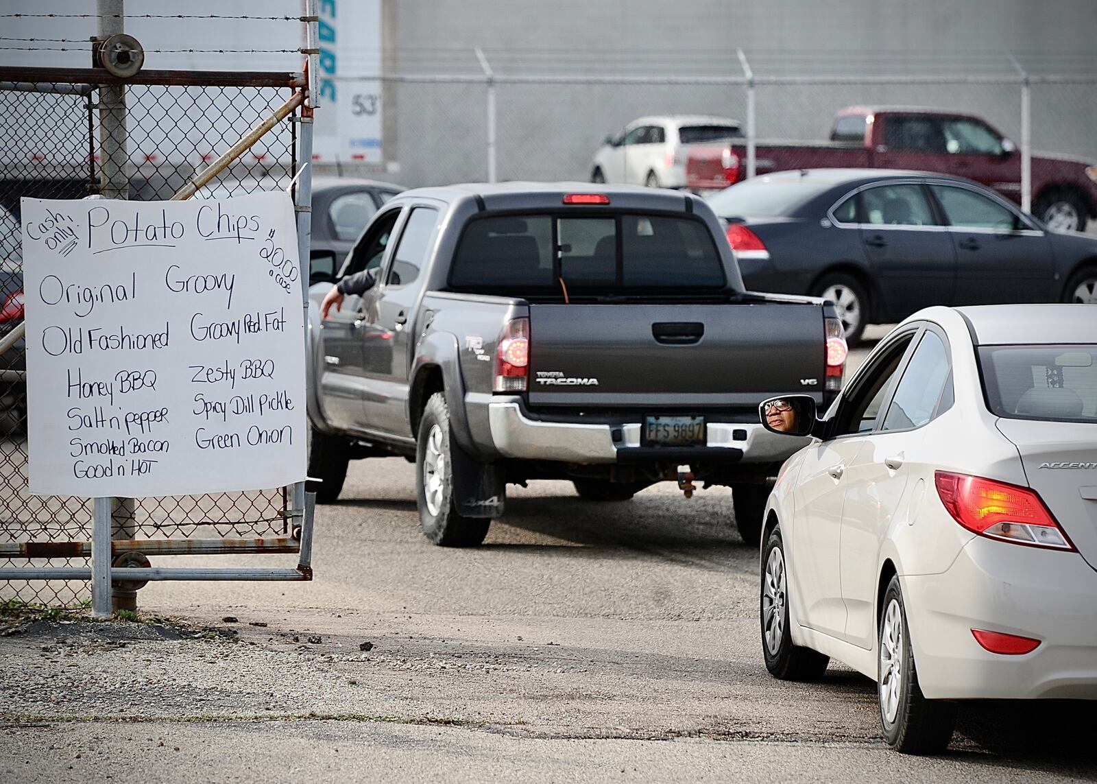 People waiting in line for over an hour to get their last chance to buy Mikesells potato chips at their facility on Leo Street Thursday morning March 2, 2023. MARSHALL GORBY \STAFF