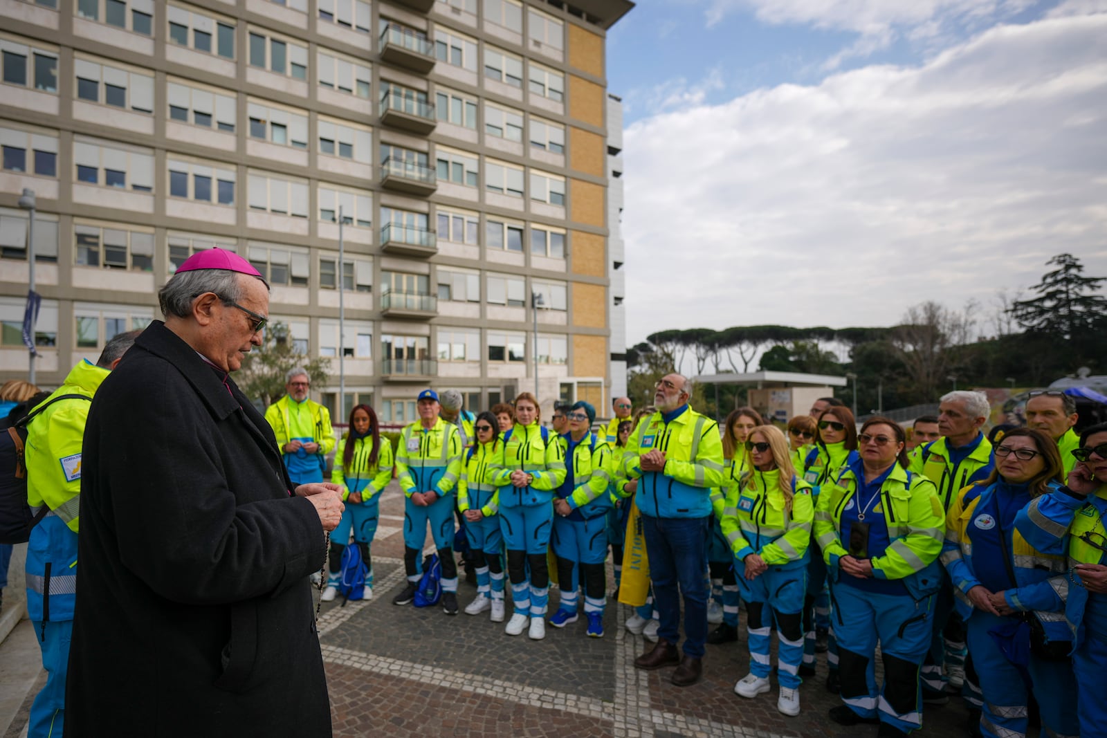 Bishop Franco Agostinelli leads a rosary prayer for Pope Francis in front of the Agostino Gemelli Polyclinic, in Rome, Saturday, March 8, 2025, where the Pontiff is hospitalized since Friday, Feb. 14. (AP Photo/Andrew Medichini)