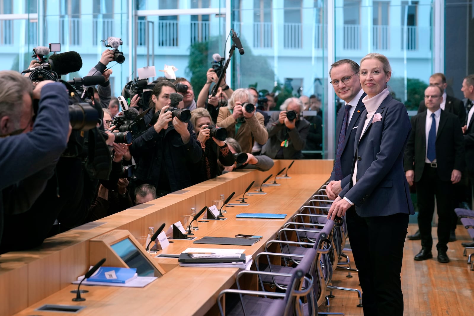 Alice Weidel, co-leader of the Alternative for Germany Party (AfD),, front right, and Tino Chrupalla, co-leader of the Alternative for Germany Party (AfD), front left, arrive for a press conference in Berlin, Germany, Monday, Feb. 24, 2025, the day after the national election. (AP Photo/Markus Schreiber)