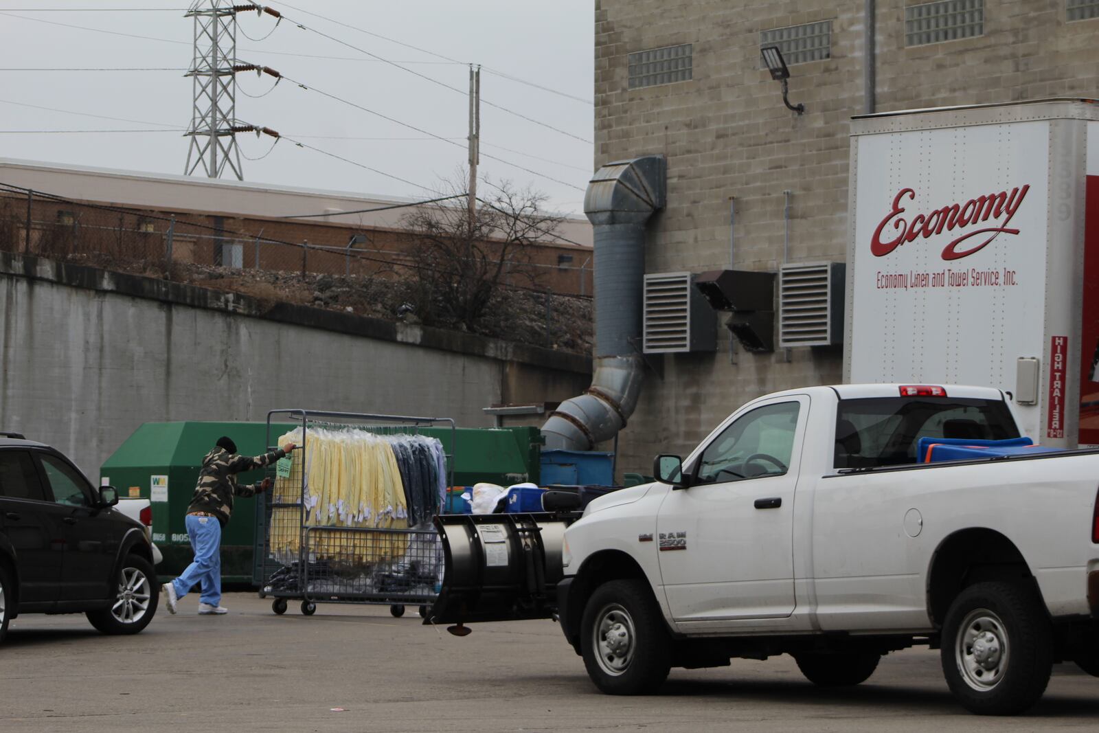 A worker pushes laundry into the Economy Linen and Towel Service Inc. facility at 80 Mead St. in downtown Dayton. CORNELIUS FROLIK / STAFF