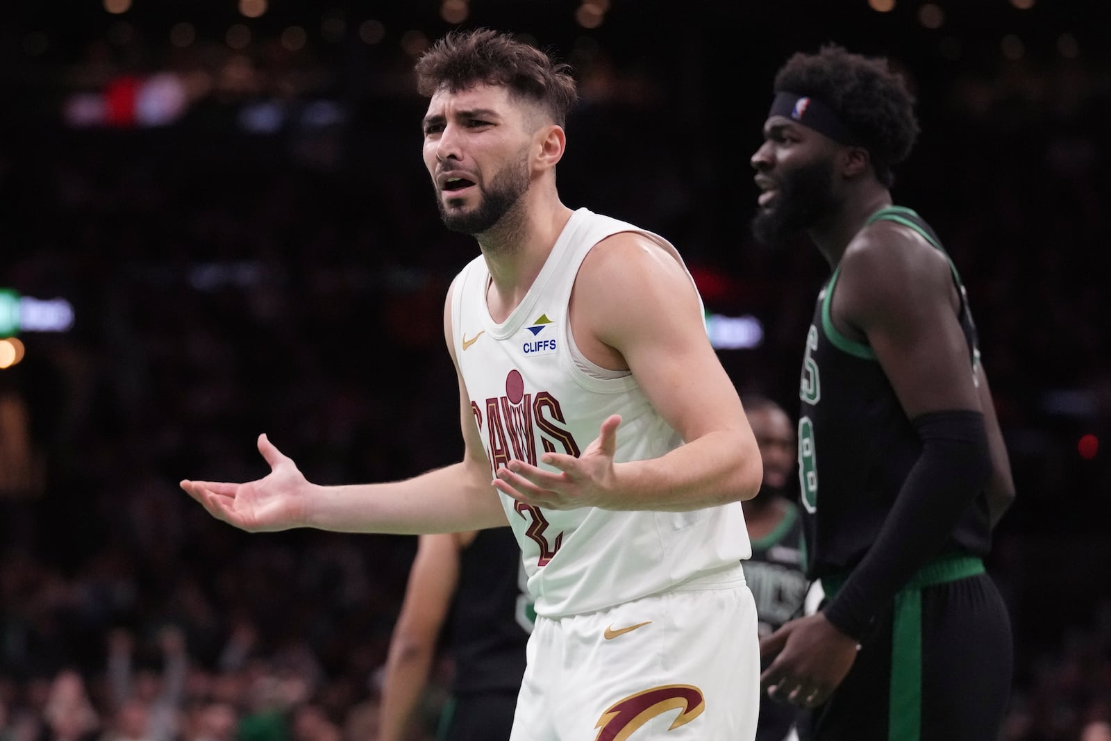 Cleveland Cavaliers guard Ty Jerome (2) argues a call during the second half of an Emirates NBA Cup basketball game against the Boston Celtics, Tuesday, Nov. 19, 2024, in Boston. The Cavaliers, who were undefeated this season, lost to the Celtics 120-117. (AP Photo/Charles Krupa)