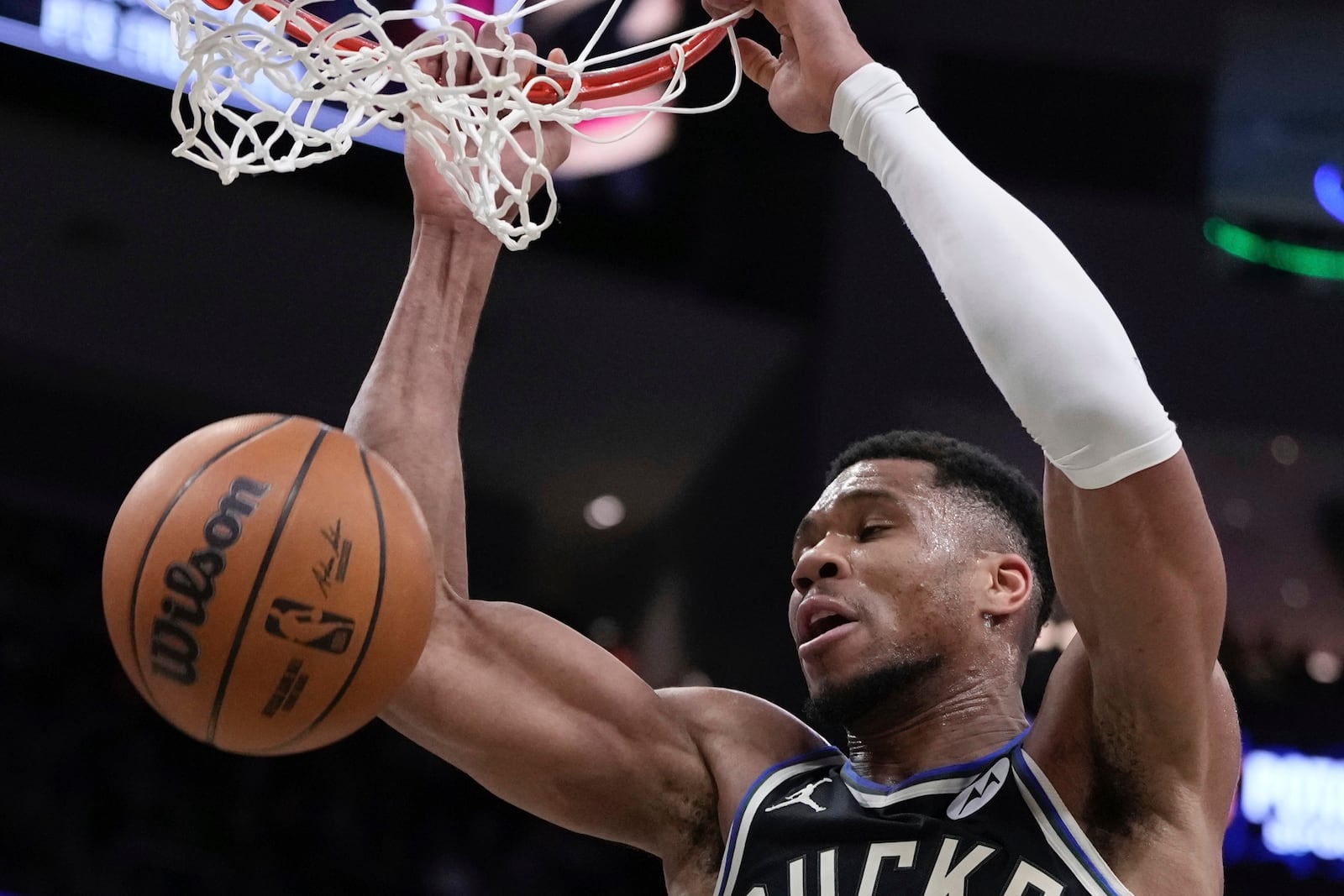 Milwaukee Bucks' Giannis Antetokounmpo dunks during the first half of an NBA basketball game Sunday, Mar. 9, 2025, in Milwaukee. (AP Photo/Morry Gash)