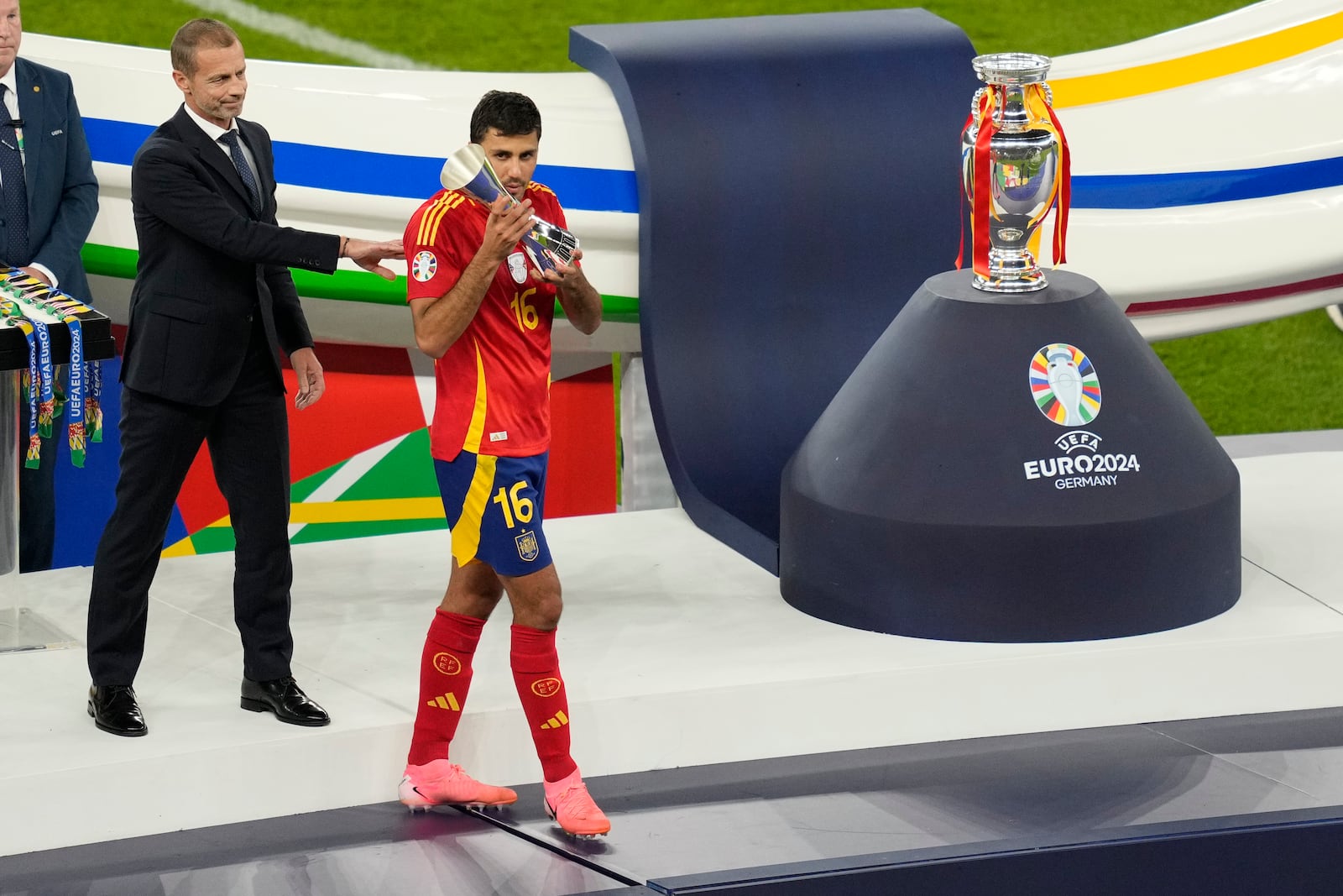 FILE - Spain's Rodri holds the player of the tournament trophy after the final match between Spain and England at the Euro 2024 soccer tournament in Berlin, Germany, July 14, 2024. (AP Photo/Andreea Alexandru, File)