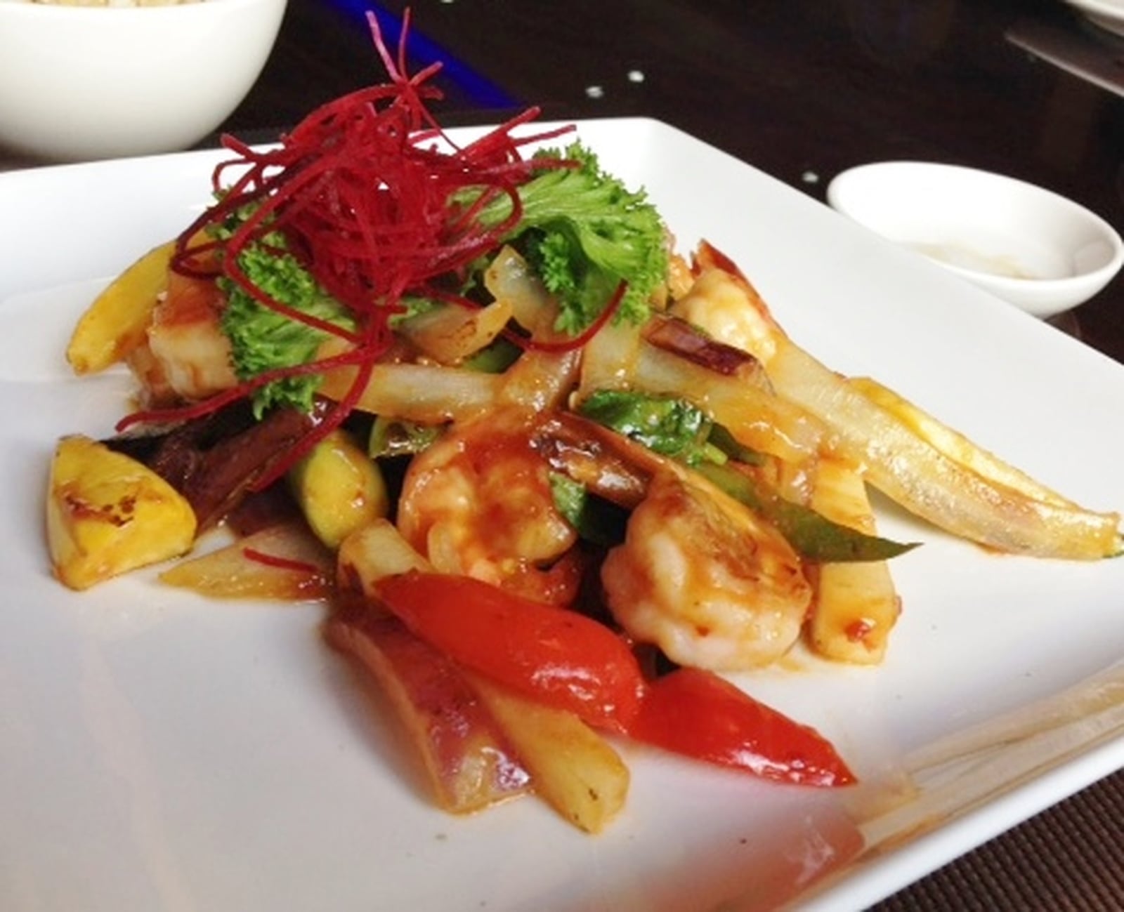 Sky Asian Cuisine’s Thai Basil Shrimp, with red bell pepper, green bell pepper, onion, red onion, yellow squash, eggplant, tail-on shrimp and Thai basil. MARK FISHER/STAFF