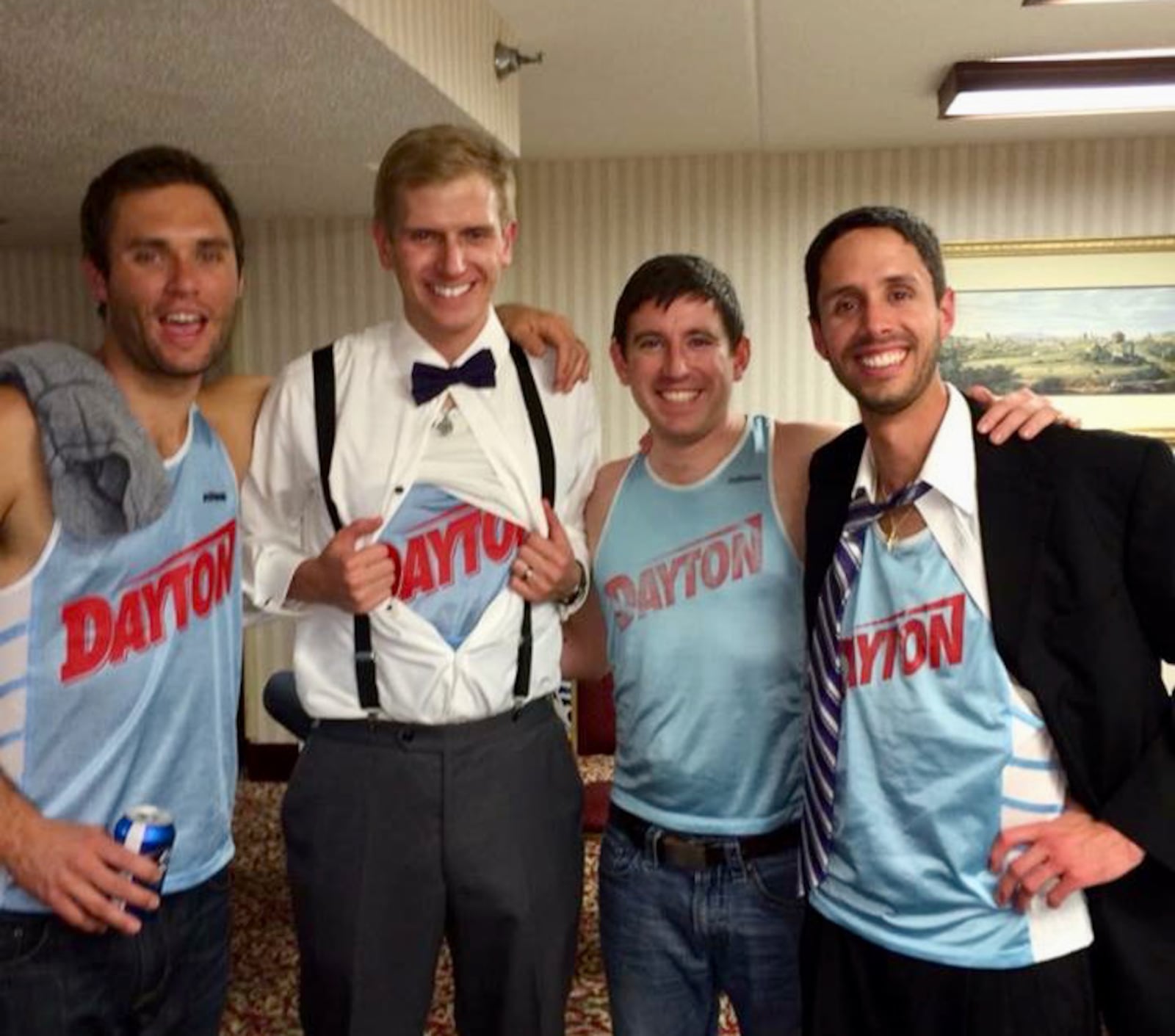 Members of the 2003 Dayton Flyers cross country team show off their old Chapel Blue uniforms they wore for one season at a wedding. Contributed photo