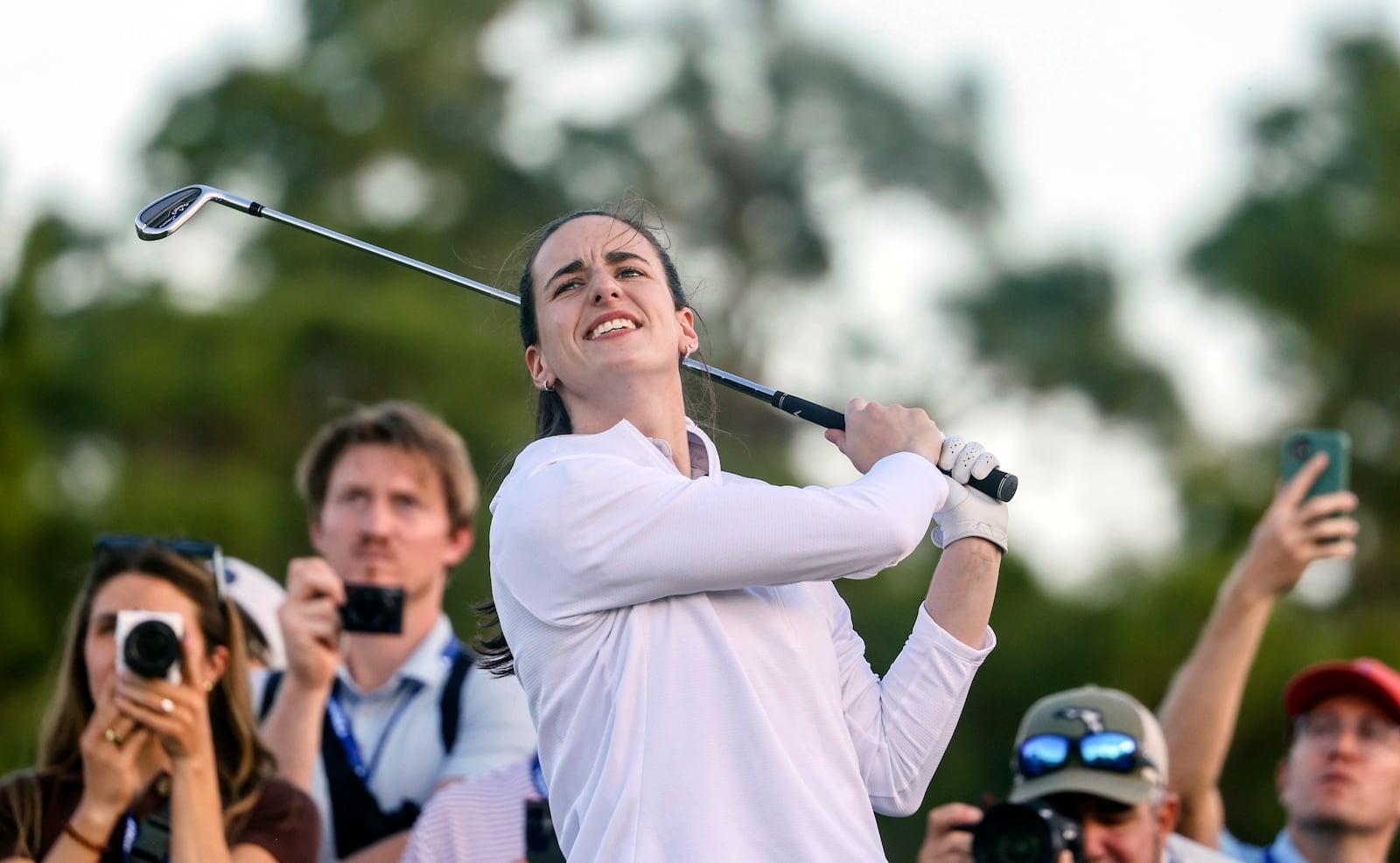 WNBA basketball Caitlin Clark, of the Indiana Fever, plays an iron from the ninth teduring the pro-am at the LPGA Tour golf tournament, Wednesday, Nov 13, 2024, at the Pelican Golf Club in Belleair, Fla. (Douglas R. Clifford/Tampa Bay Times via AP)