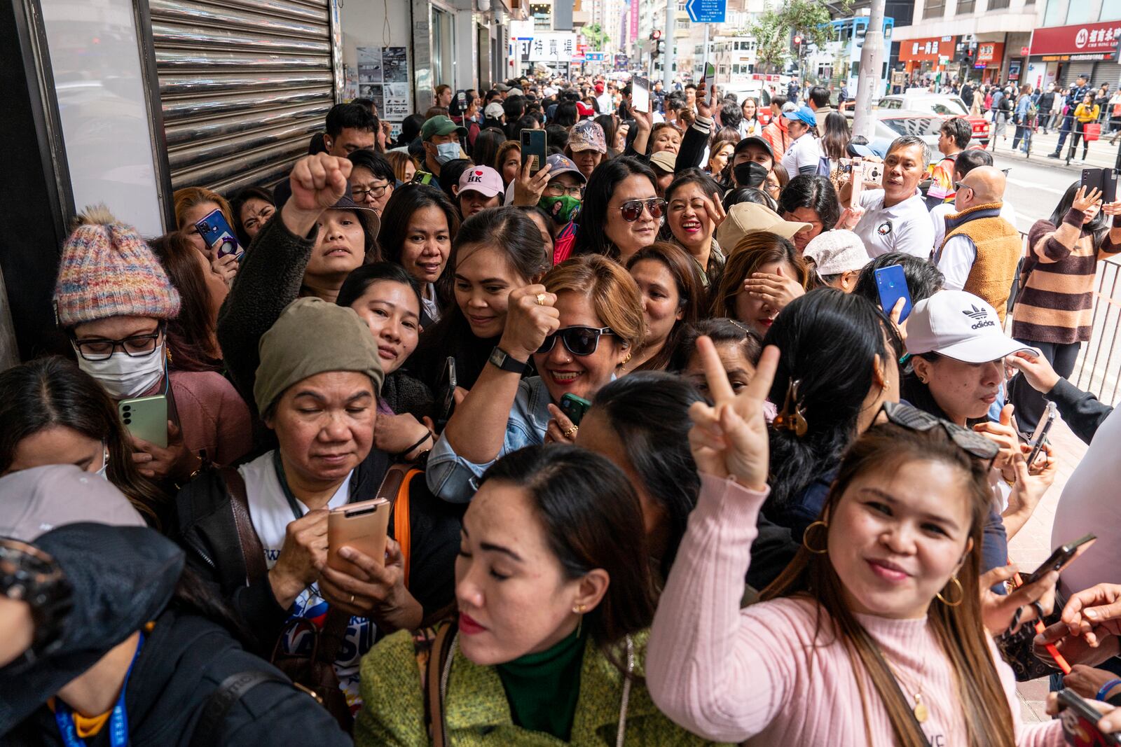 Supporters of former populist President of the Philippines Rodrigo Duterte waits for his arrival at a thanksgiving gathering organized by Hong Kong-based Filipino workers in Hong Kong on Sunday, March 9, 2025. (AP Photo/Vernon Yuen)