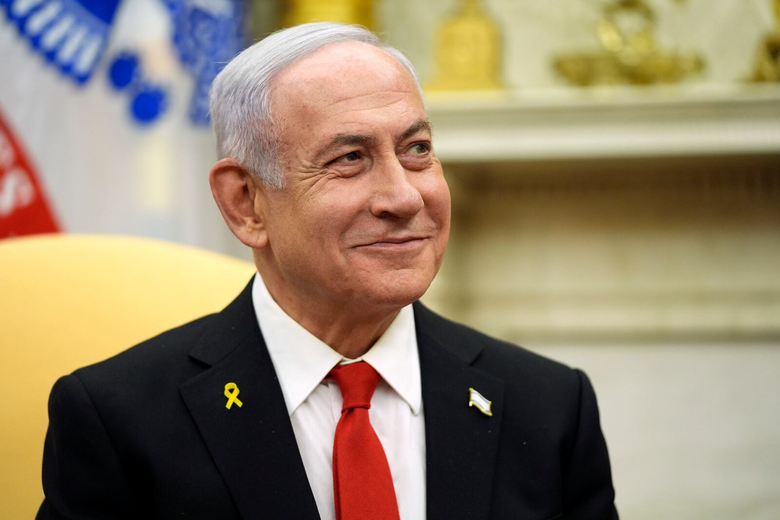 Israel's Prime Minister Benjamin Netanyahu listens as he meets with President Donald Trump in the Oval Office of the White House, Tuesday, Feb. 4, 2025, in Washington. (AP Photo/Evan Vucci)