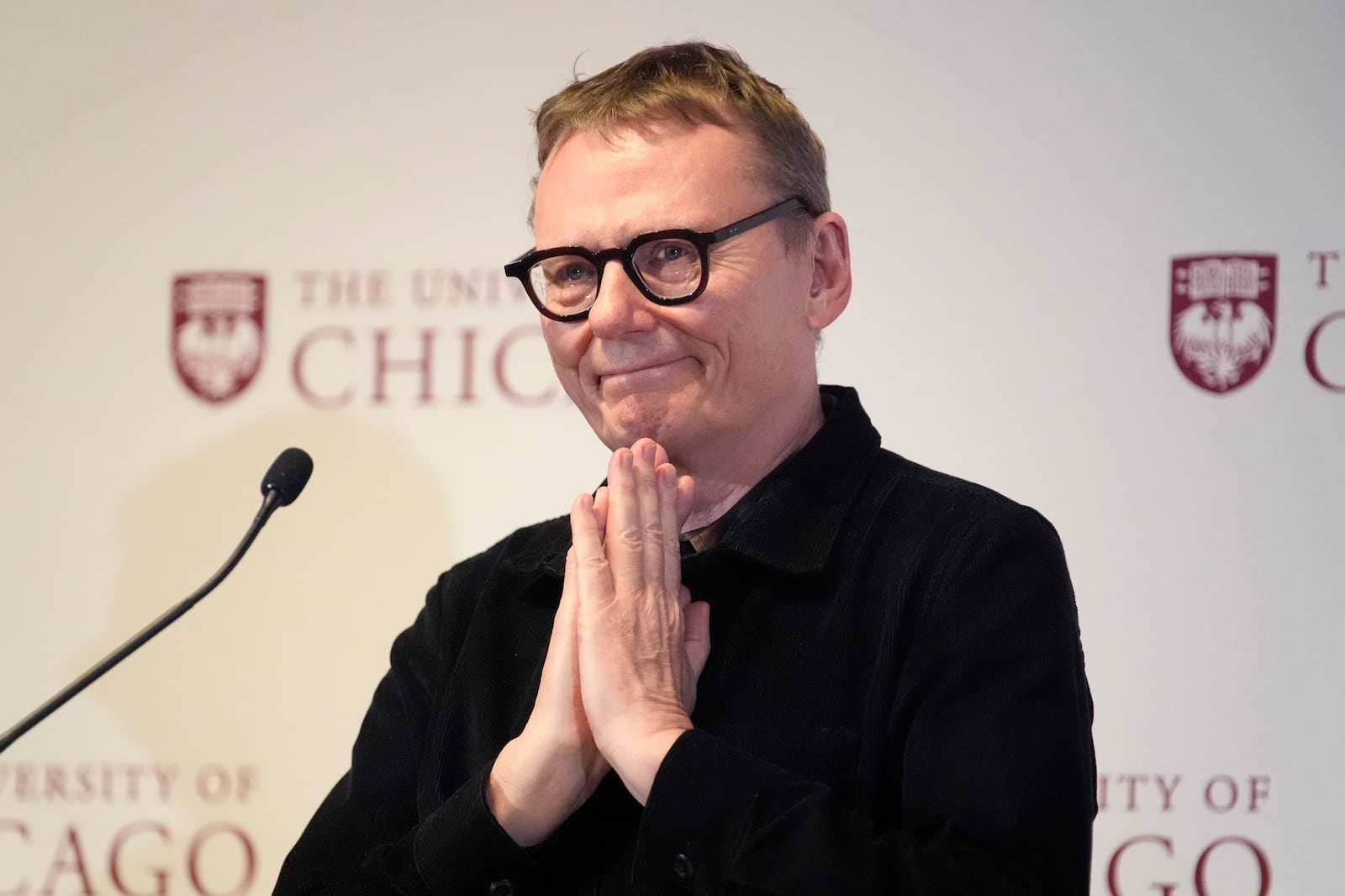 University of Chicago professor James A. Robinson, one of three winners of the 2024 Nobel Prize in Economics, responds to a standing ovation during a news conference celebrating Robinson at university Monday, Oct. 14, 2024, in Chicago. (AP Photo/Charles Rex Arbogast)