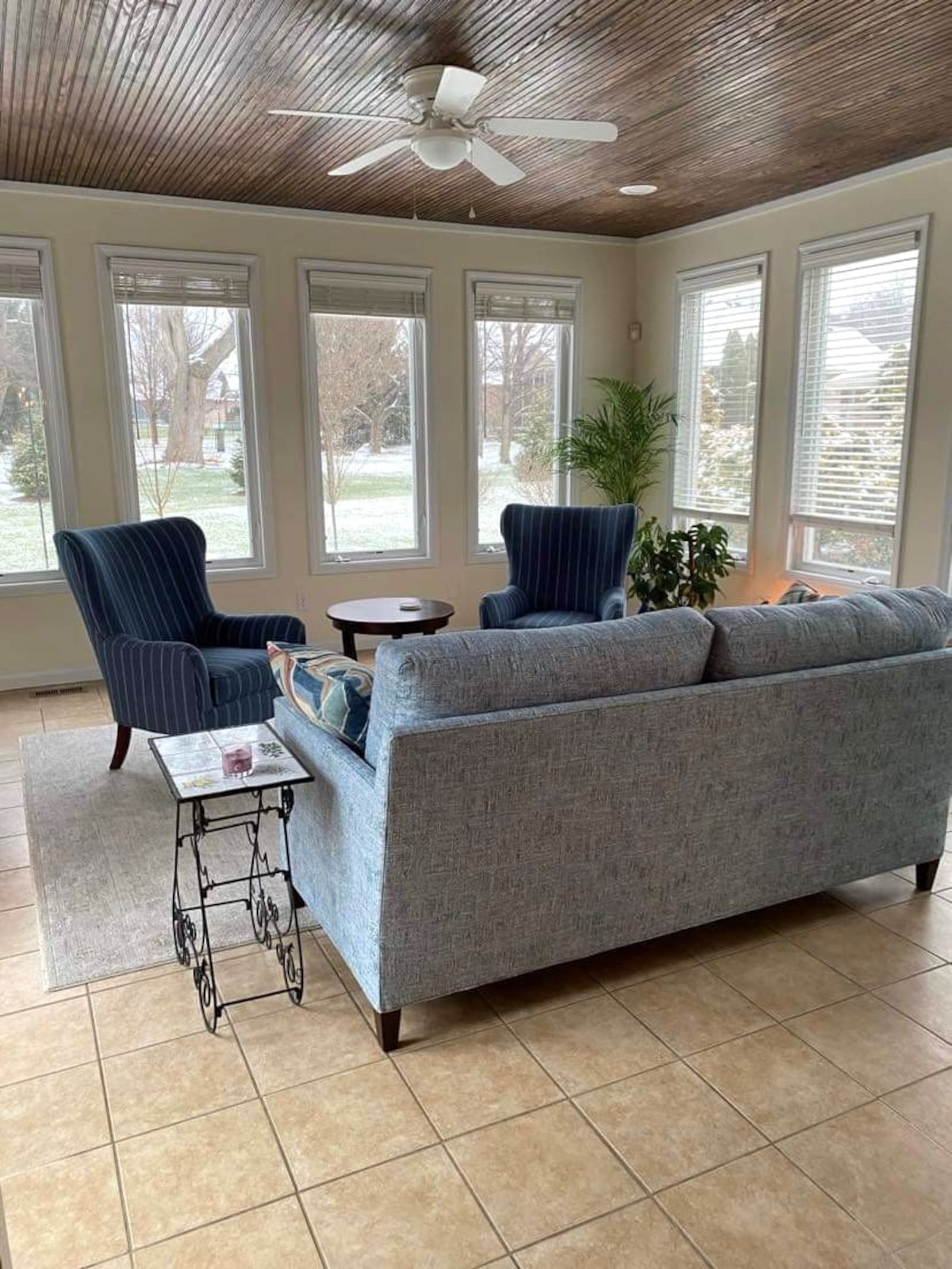 The sunroom is a favorite gathering spot for morning coffee and happy hour in the evening. 