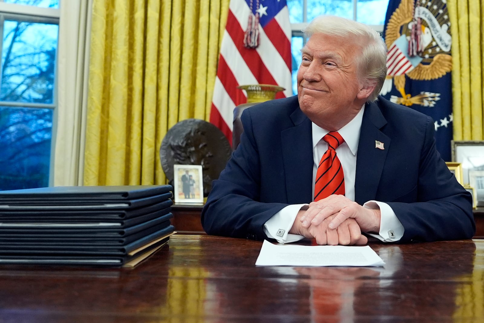 President Donald Trump speaks with reporters as he signs executive orders in the Oval Office at the White House, Monday, Feb. 10, 2025, in Washington. (Photo/Alex Brandon)