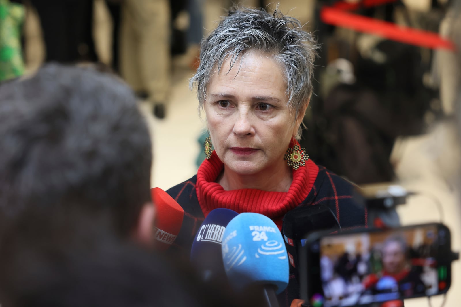 Actress and witness Anouk Grinberg arrives at the courtroom as French actor Gérard Depardieu, who is facing trial for the alleged sexual assaults of two women on a film set in 2021, won't appear before a criminal court, Monday, Oct. 28, 2024 in Paris. (AP Photo/Thomas Padilla)