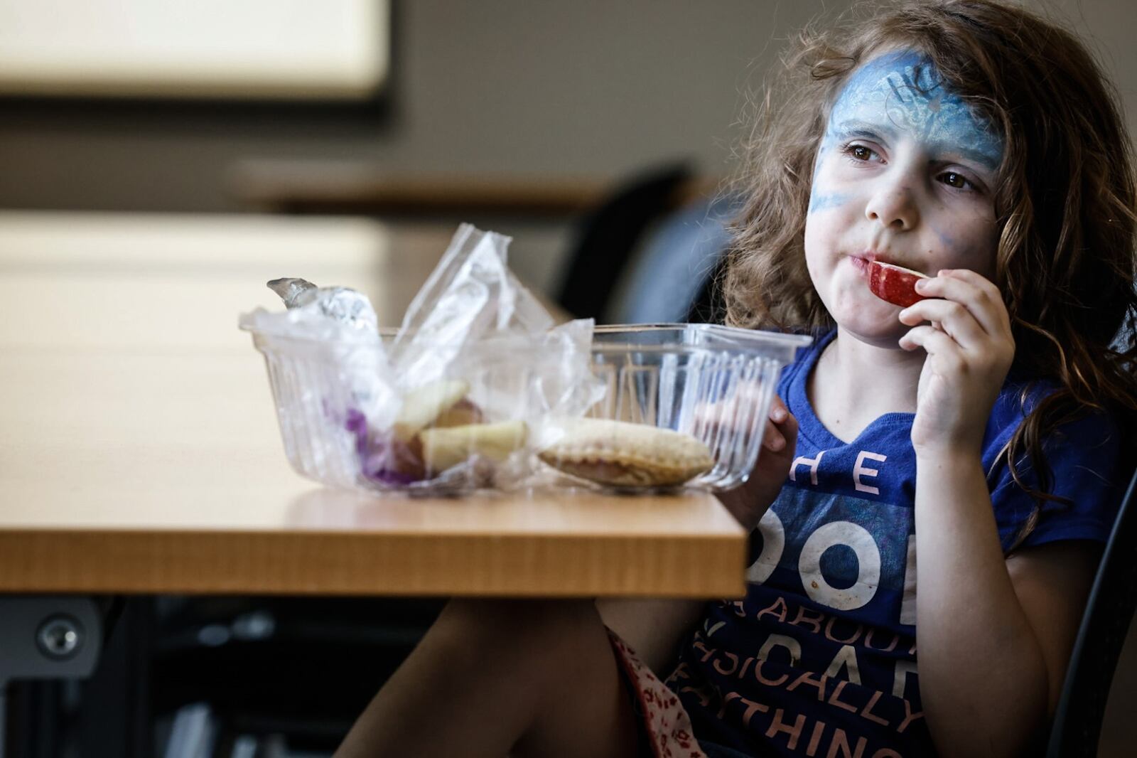 Renesmee Lehlkuhle, 6, enjoys lunch at the Northwest Dayton Library on Philadelphia Drive in Dayton Monday June 3, 2024. Local libraries are helping to prevent the "summer slide." JIM NOELKER/STAFF