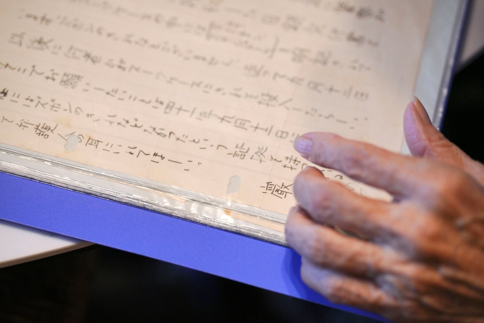 Hideko Hakamada, sister of Iwao Hakamada, shows a letter from her brother to his mother during an interview with The Associated Press in Hamamatsu, Shizuoka prefecture, central Japan, Thursday, Oct. 17, 2024. (AP Photo/Eugene Hoshiko)