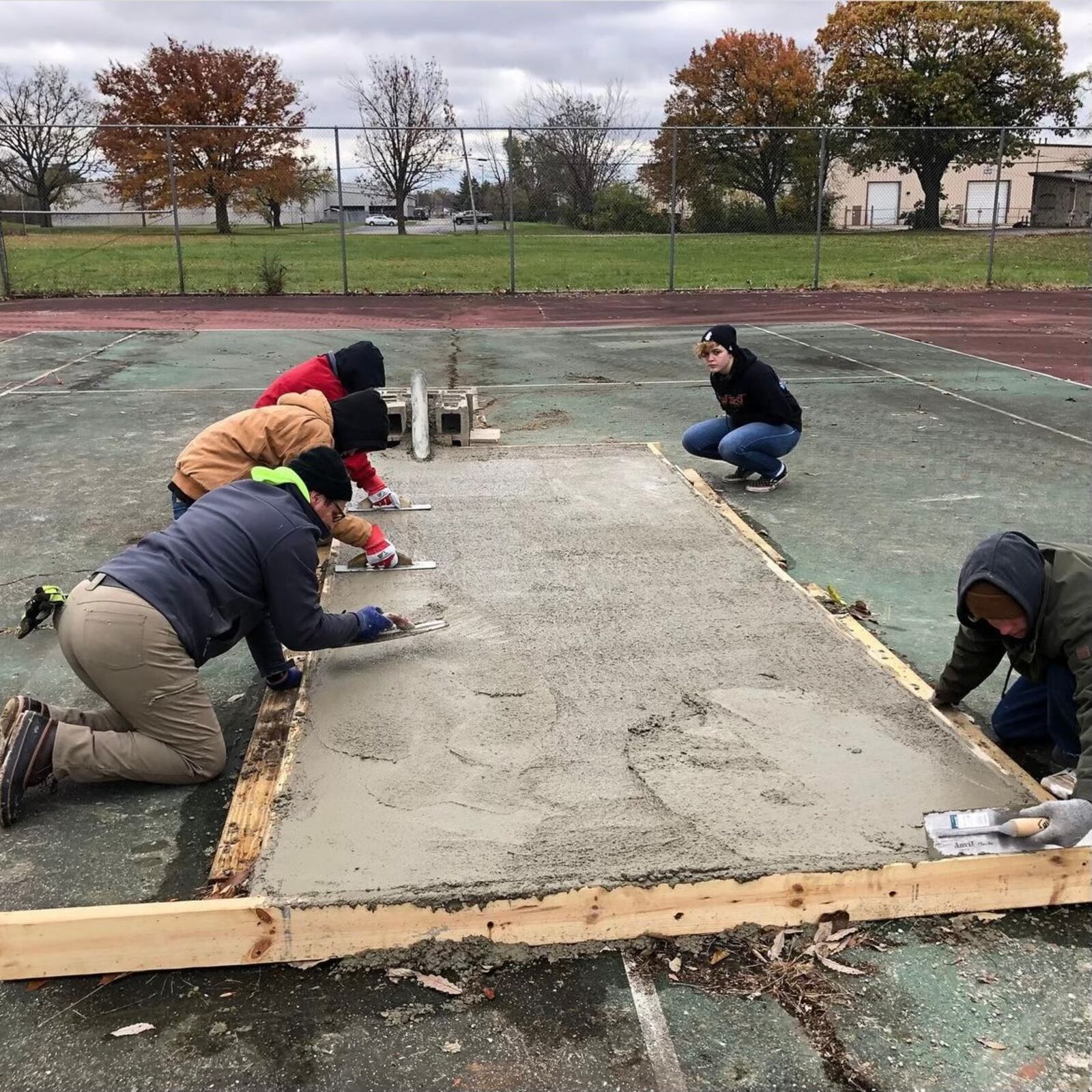 David Schweitzer (bottom left), the project manager for the DIY skate park at Claridge Park, working with a team of volunteers to build an obstacle. This and the DIY park on Home Avenue are in development with assistance from The Collaboratory in Dayton and Rhymesayers Entertainment in Minneapolis.