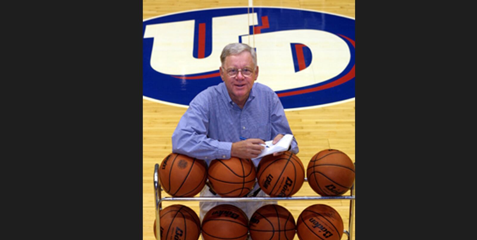 Bucky Albers poses for a photo at UD Arena during his days at the Dayton Daily News beat writer covering the Flyers. Photo by Jim Witmer