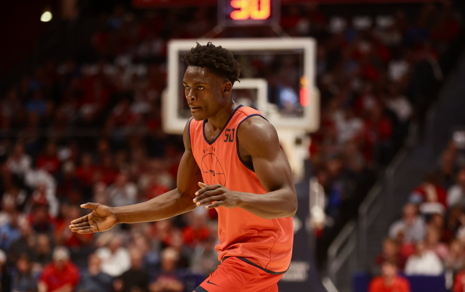 Dayton's Enoch Cheeks reacts after making a 3-pointer against Ohio State an exhibition game on Sunday, Oct. 22, 2023, at UD Arena. David Jablonski/Staff